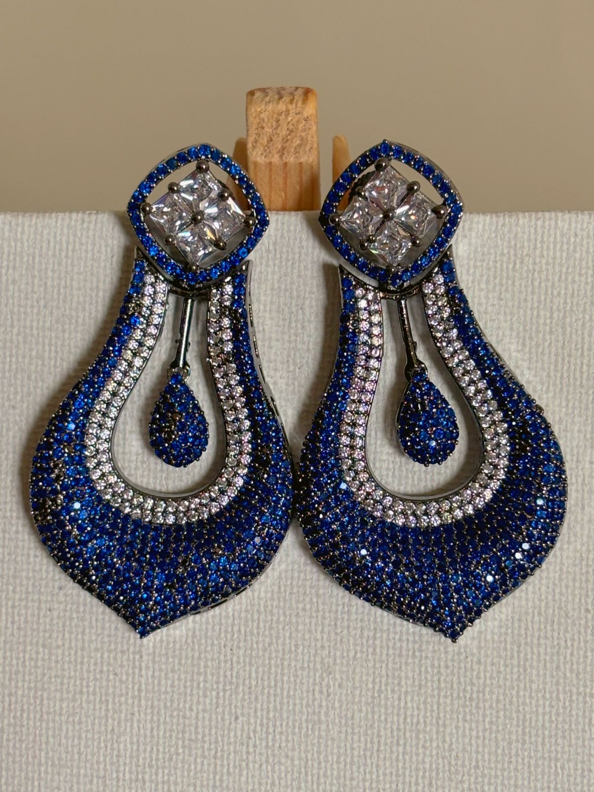 Shop celebrity look long AD Earrings online in blue stones. Shop from an exclusive range of zircon earrings, bridal AD jewelry, silver plated earrings, rhodium plated jewellery, AD earrings, AD earrings sets for coats, gowns and lehengas. -first
