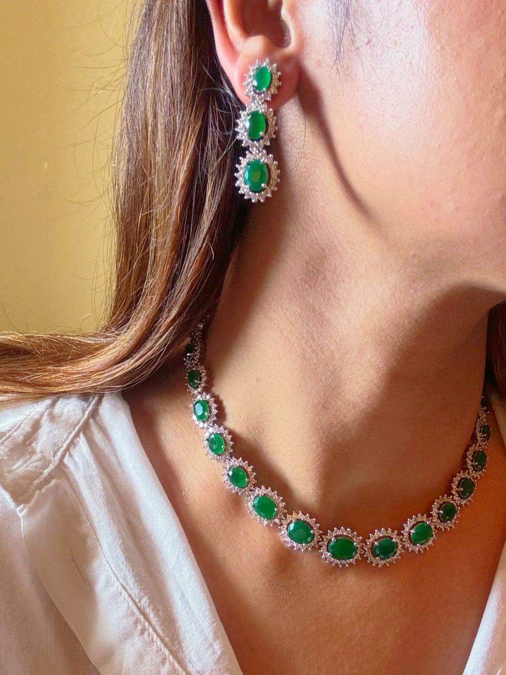 Shop Light Partywear AD Necklace in India. Explore elegant bridal AD jewellery online. Shop premium bridal jewellery sets in Zircon, AD, Kundan, Victorian Diamond. Collection best suited for Indian weddings, parties and special occasions. Choose AD Necklace In Green stone for weddings, sangeet and engagement. -side