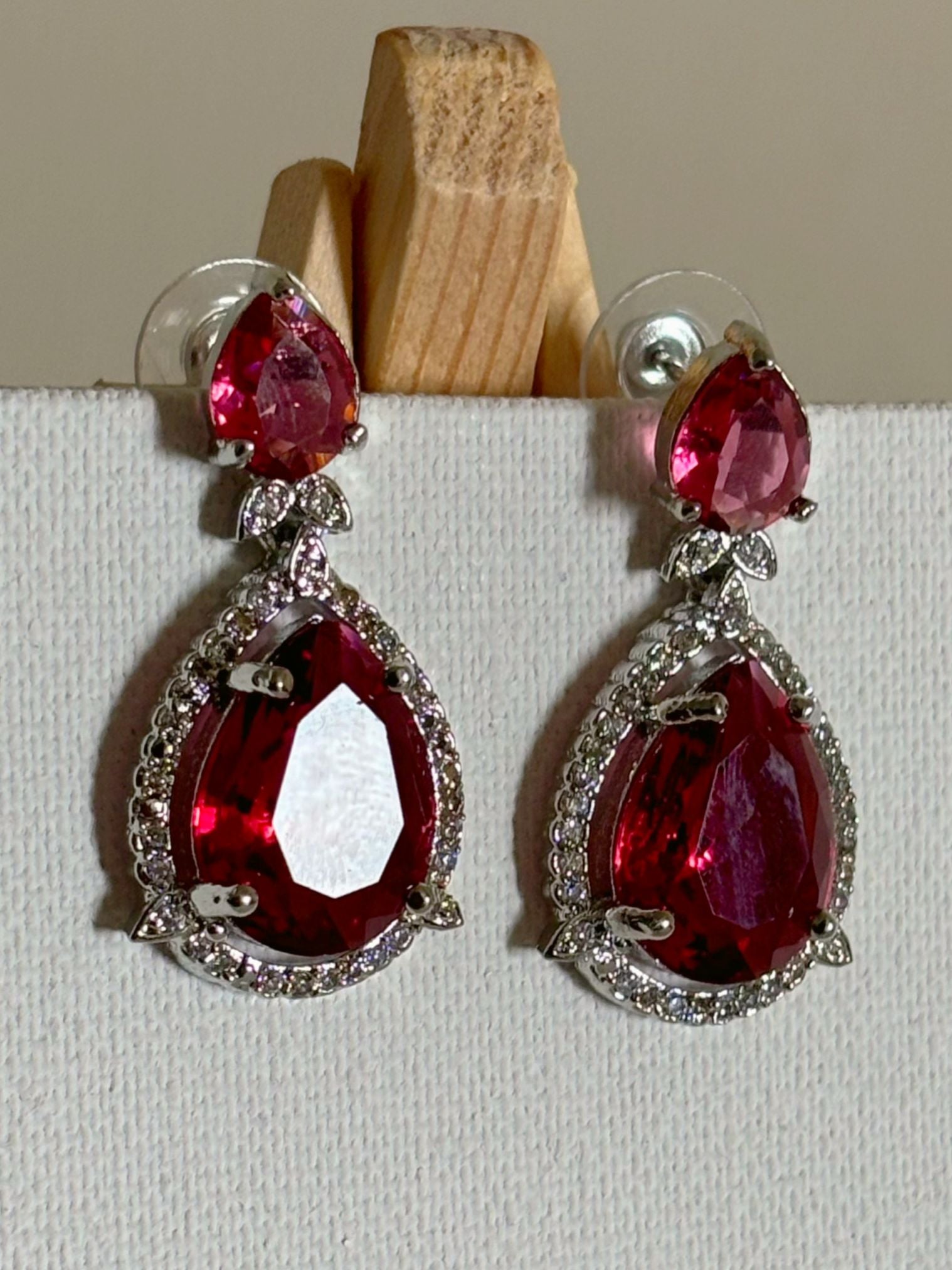 Shop Celebrity Look Double Drop Red Stone AD Earrings online. Shop from an exclusive range of zircon earrings, bridal AD jewelry, silver plated earrings, rhodium plated jewellery, AD earrings, AD necklace sets for coats, gowns and lehengas.  -first