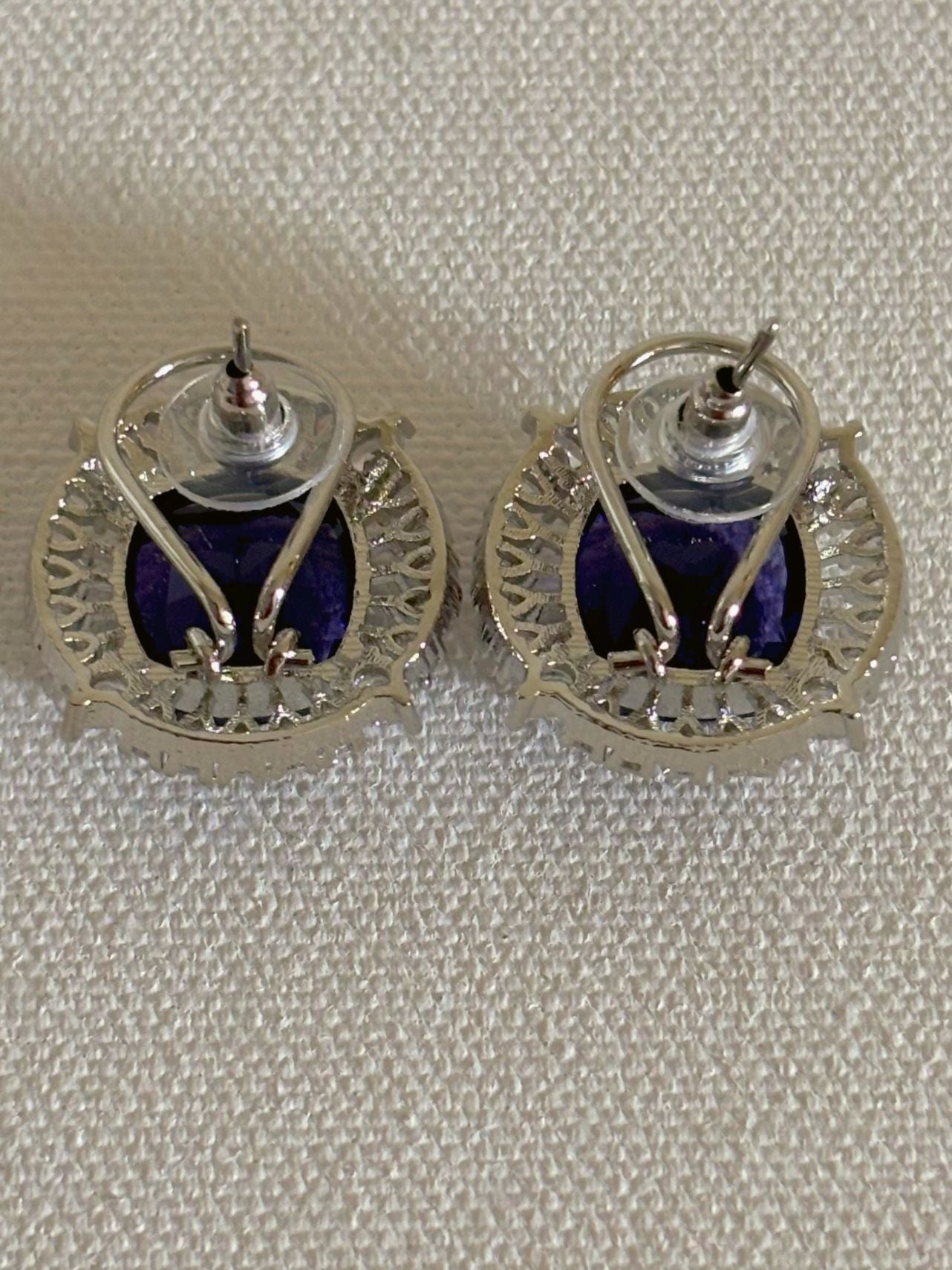 Shop Contemporary Studs In AD & Purple stone online. Shop from an exclusive range of zircon earrings, bridal AD jewelry, silver plated earrings, rhodium plated jewellery, AD earrings, AD necklace sets for weddings, engagements and parties. -back