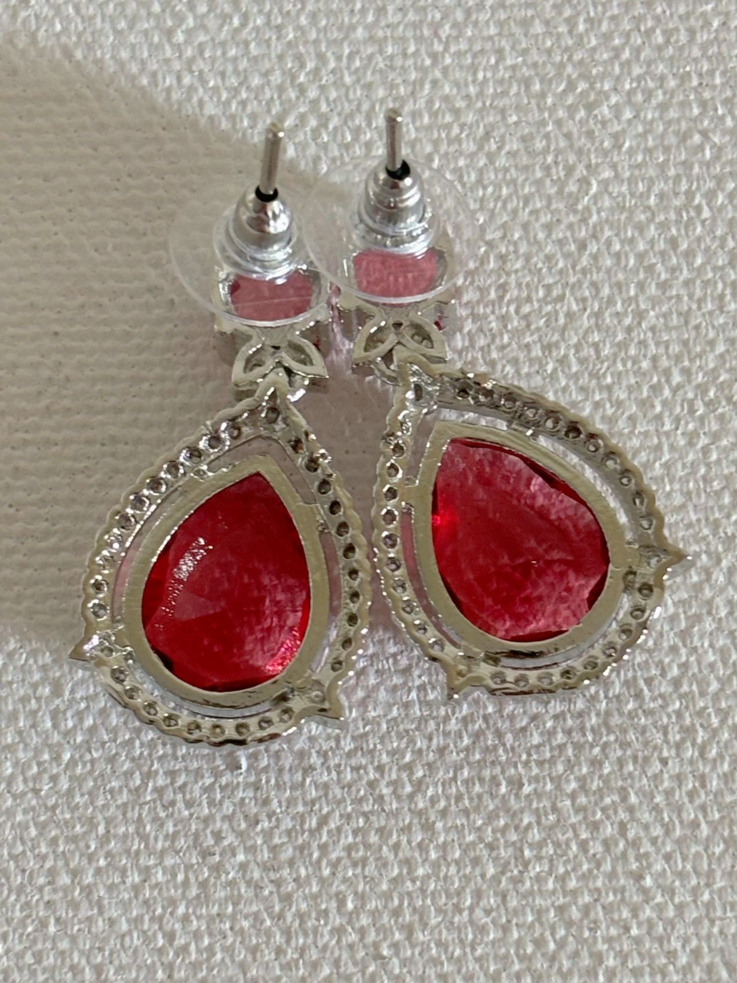 Shop Celebrity Look Double Drop Red Stone AD Earrings online. Shop from an exclusive range of zircon earrings, bridal AD jewelry, silver plated earrings, rhodium plated jewellery, AD earrings, AD necklace sets for coats, gowns and lehengas. -back