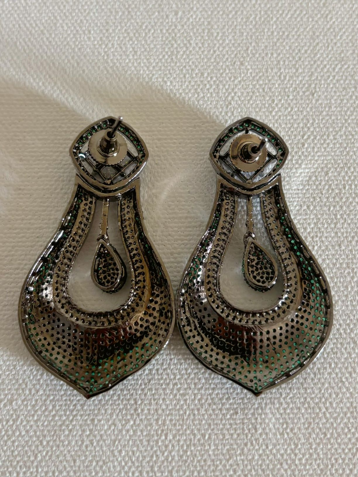Shop celebrity look long AD Earrings online in green stones. Shop from an exclusive range of zircon earrings, bridal AD jewelry, silver plated earrings, rhodium plated jewellery, AD earrings, AD earrings sets for coats, gowns and lehengas. -back