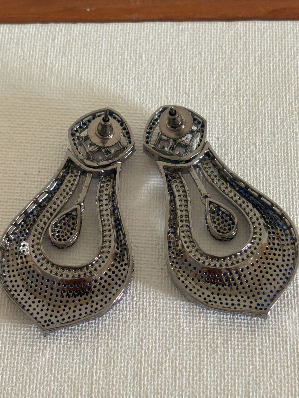Shop celebrity look long AD Earrings online in blue stones. Shop from an exclusive range of zircon earrings, bridal AD jewelry, silver plated earrings, rhodium plated jewellery, AD earrings, AD earrings sets for coats, gowns and lehengas. -back