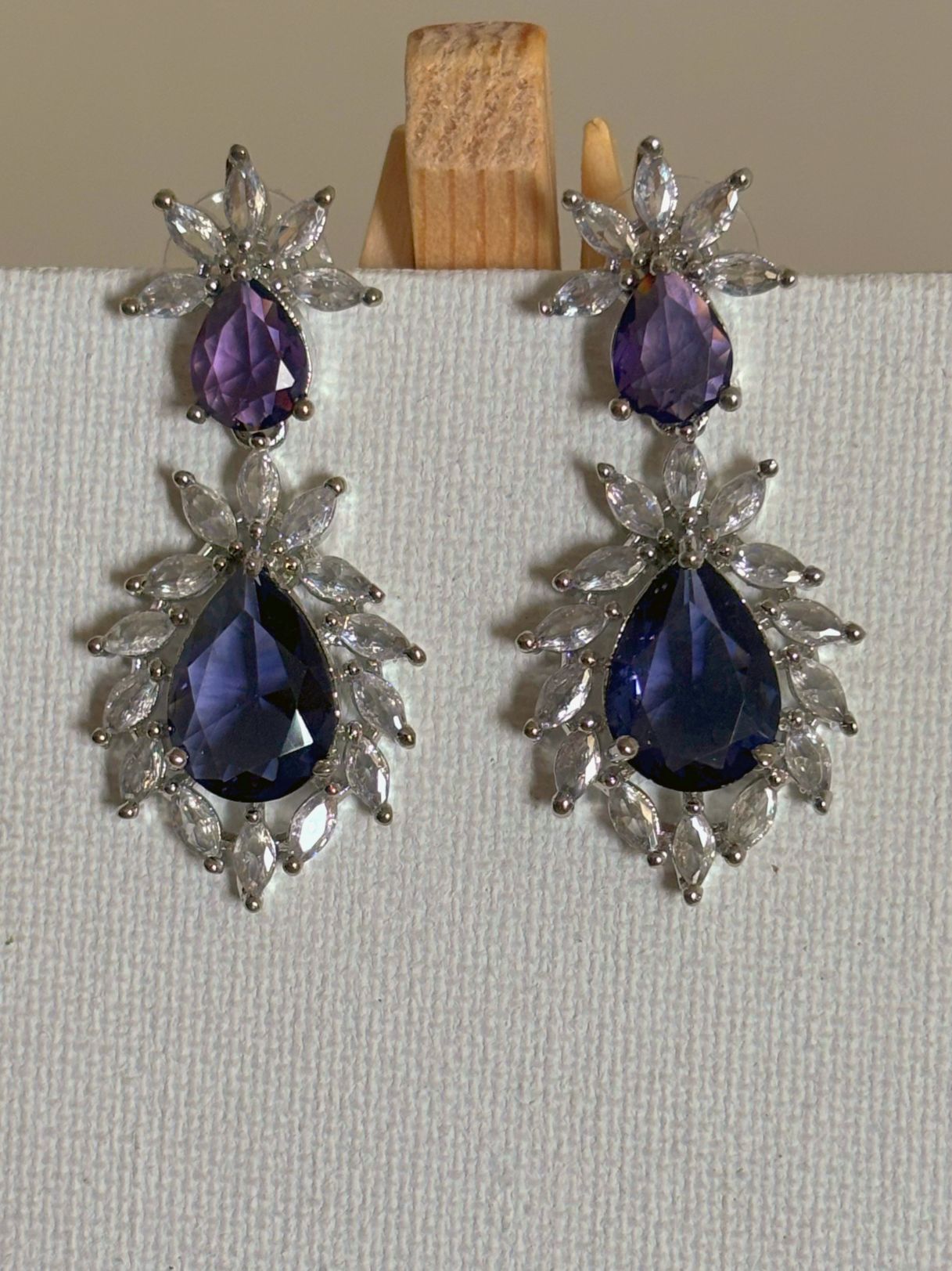Shop Stylish Double Drop Purple Stone AD Earrings online. Shop from an exclusive range of zircon earrings, bridal AD jewelry, silver plated earrings, rhodium plated jewellery, AD earrings, AD necklace sets for coats, gowns and lehengas. -front