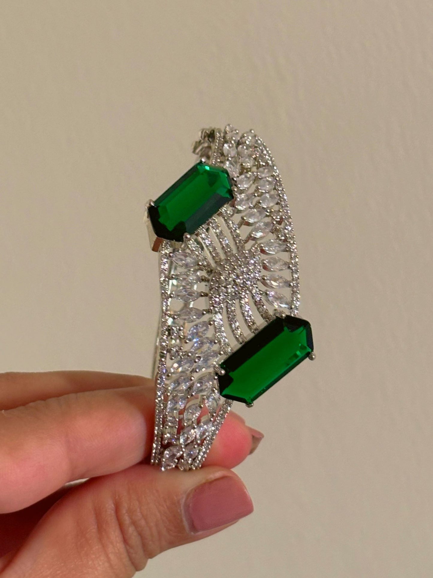 Shop BL25A010 Cocktail Night Statement AD Bracelet In Green online in India. Shop from an exclusive range of zircon jewellery, bridal wedding jewellery, silver plated earrings, rhodium plated rings, AD rings, AD earrings for weddings, engagement, cocktail night & parties. -front