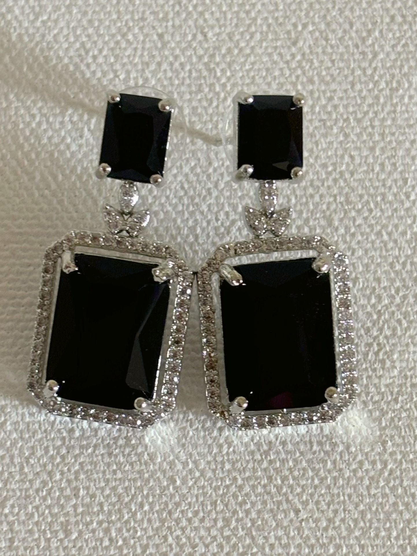 Shop women's luxury white doublet stone AD earrings online in India. Shop from an exclusive range of zircon jewellery, Indian wedding jewelry, AD earrings with saree, rhodium plated jewellery, AD necklace sets for weddings and engagement. AD jewellery in black stone. -back