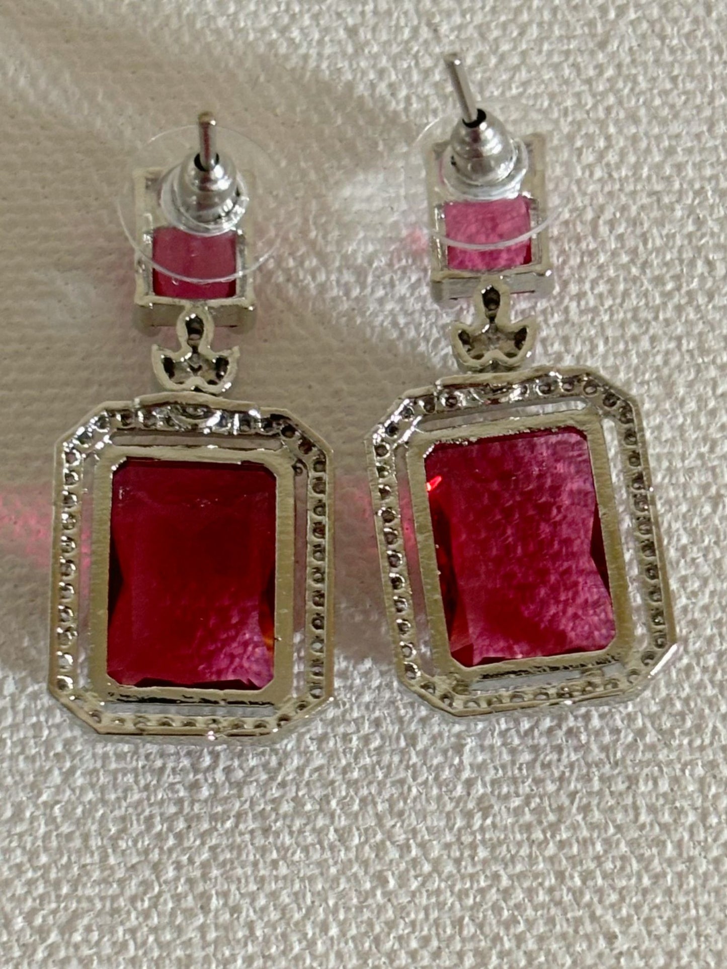 Shop women's luxury white doublet stone AD earrings online in India. Shop from an exclusive range of zircon jewellery, Indian wedding jewelry, AD earrings with saree, rhodium plated jewellery, AD necklace sets for weddings and engagement. AD jewellery in red stone. -back