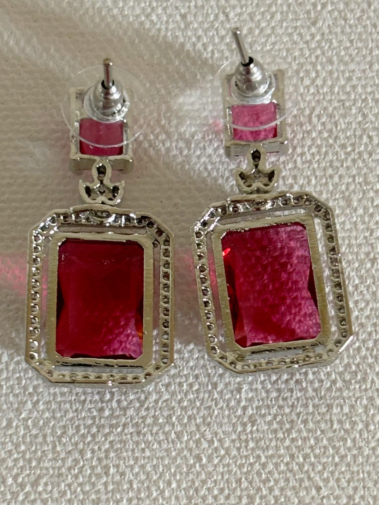 Shop women's luxury white doublet stone AD earrings online in India. Shop from an exclusive range of zircon jewellery, Indian wedding jewelry, AD earrings with saree, rhodium plated jewellery, AD necklace sets for weddings and engagement. AD jewellery in red stone. -back