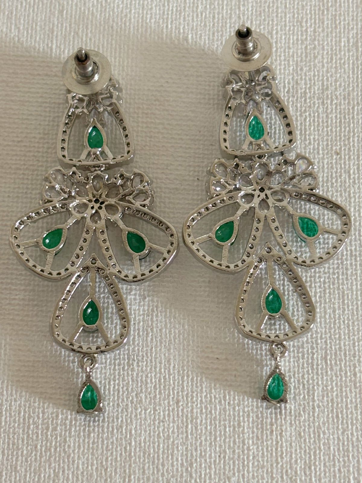 Shop women's luxury green stone AD earrings online in India. Shop from an exclusive range of zircon jewellery, Indian wedding jewelry, gold plated earrings, rhodium plated jewellery, AD earrings, AD necklace sets for weddings, engagements and parties. -back