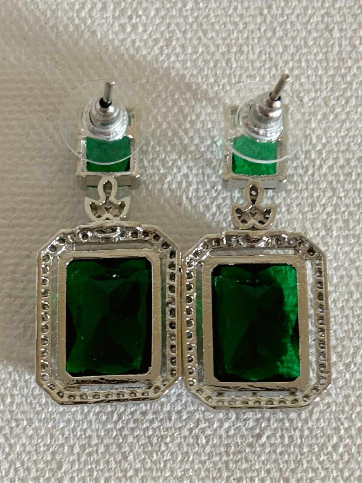 Shop women's luxury white doublet stone AD earrings online in India. Shop from an exclusive range of zircon jewellery, Indian wedding jewelry, AD earrings with saree, rhodium plated jewellery, AD necklace sets for weddings and engagement. AD jewellery in green stone. -back