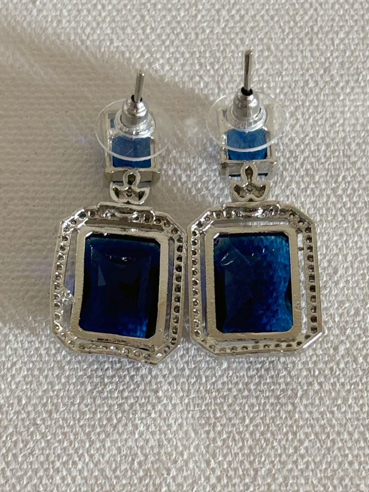 Shop women's luxury white doublet stone AD earrings online in India. Shop from an exclusive range of zircon jewellery, Indian wedding jewelry, AD earrings with saree, rhodium plated jewellery, AD necklace sets for weddings and engagement. AD jewellery in blue stone - back