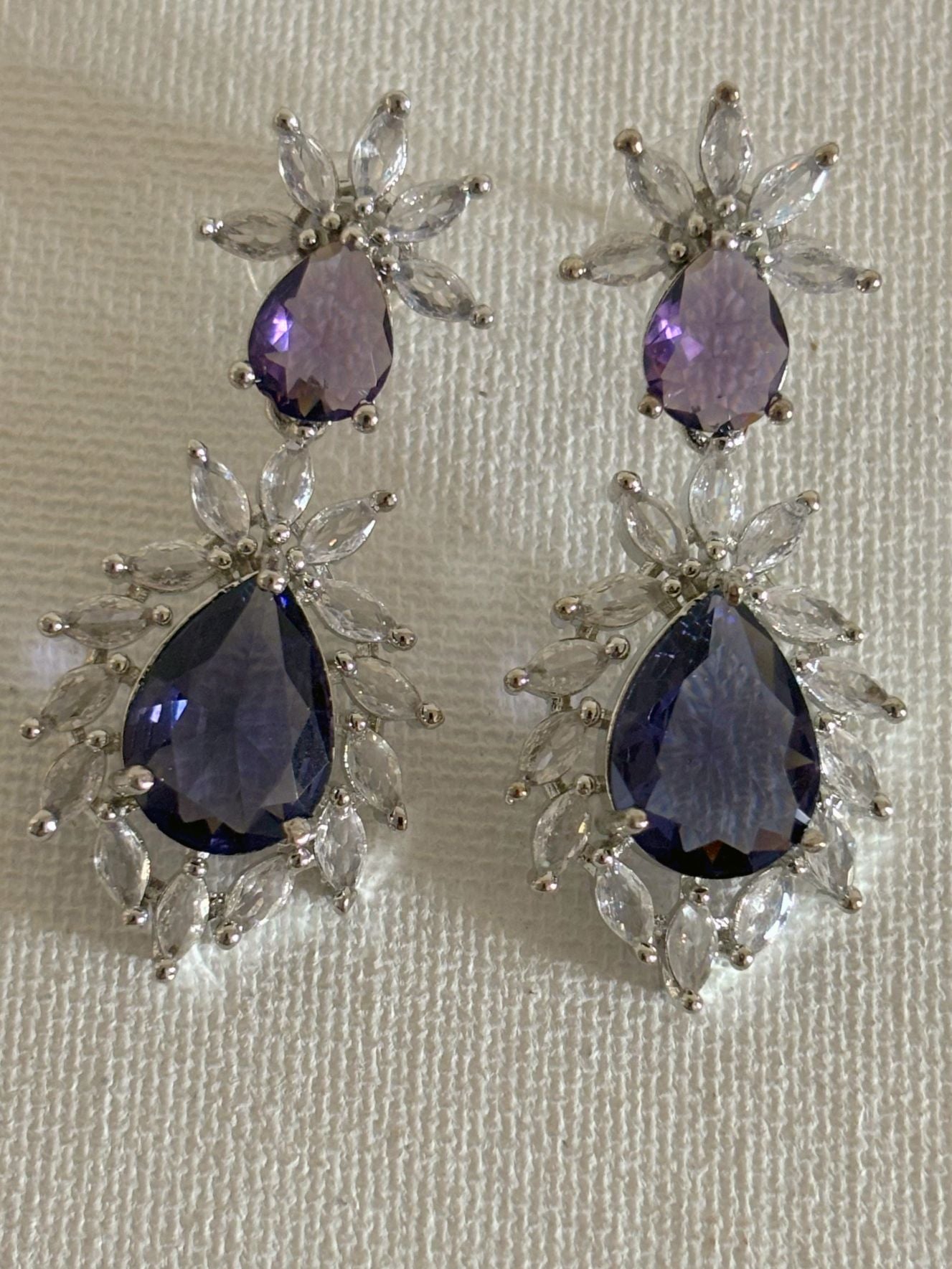 Shop Stylish Double Drop Purple Stone AD Earrings online. Shop from an exclusive range of zircon earrings, bridal AD jewelry, silver plated earrings, rhodium plated jewellery, AD earrings, AD necklace sets for coats, gowns and lehengas. -first