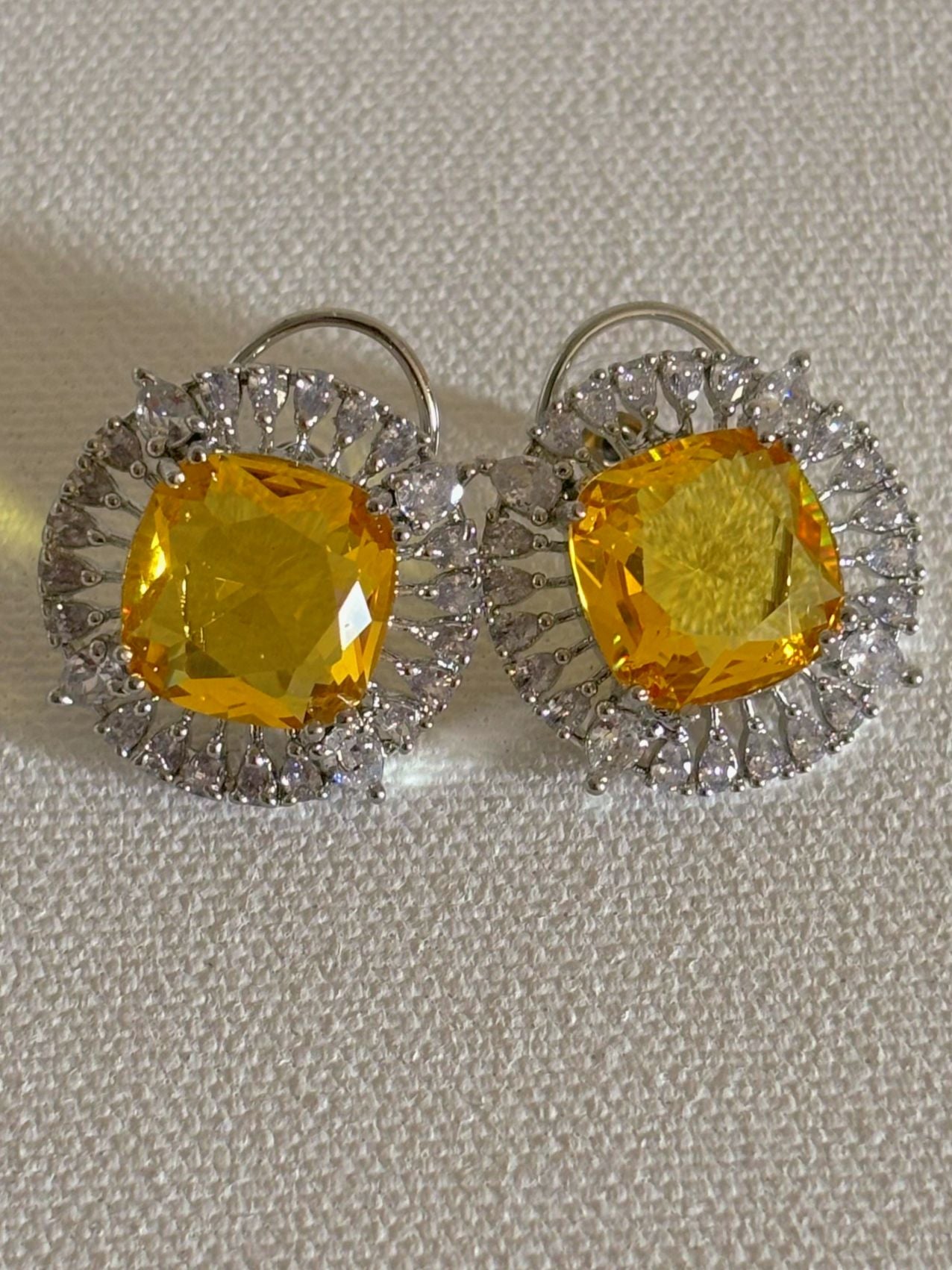Shop Contemporary Studs In AD & Golden Yellow Stone online. Shop from an exclusive range of zircon earrings, bridal AD jewelry, silver plated earrings, rhodium plated jewellery, AD earrings, AD necklace sets for weddings, engagements and parties. -second
