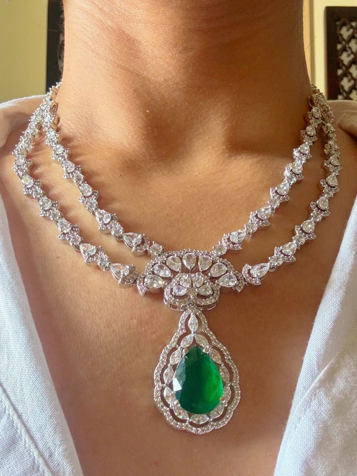 Shop Green Stone AD Necklace online in India. Perfect for brides and bridesmaid seeking elegant bridal AD jewellery online. Explore premium bridal jewellery sets in Zircon, AD, Kundan, Victorian Diamond. Collection ideal for Indian weddings, parties and special occasions. -Neck