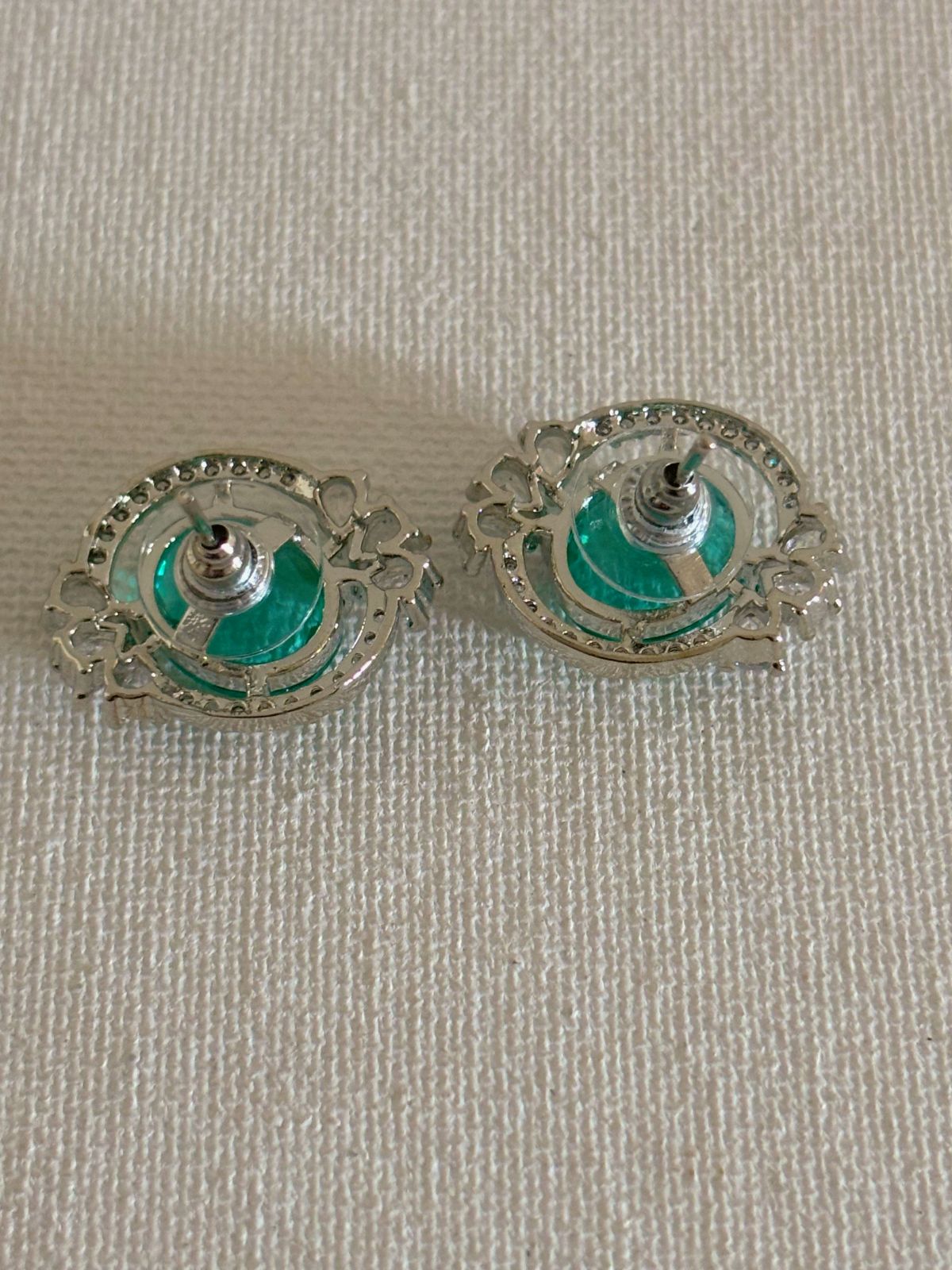 Shop Celebrity Studs In AD & Green stone online. Shop from an exclusive range of zircon earrings, bridal AD jewelry, silver plated earrings, rhodium plated jewellery, AD earrings, AD necklace sets for weddings, engagements and parties. -back