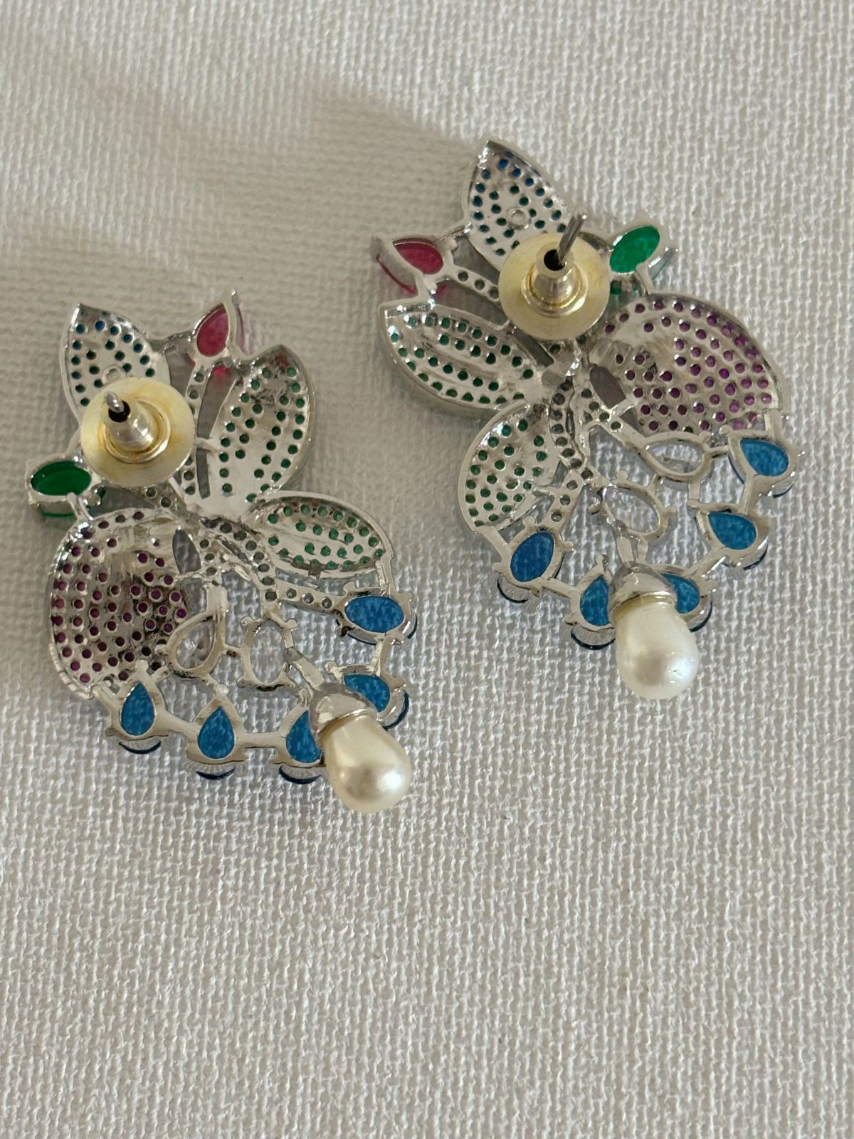 Shop women's stylish multi-colored stones AD earrings online in India. Shop from an exclusive range of zircon jewellery, bridal wedding jewelry, silver plated earrings, rhodium plated jewellery, AD earrings, AD necklace sets for weddings, engagement, receptions and office events.  -back
