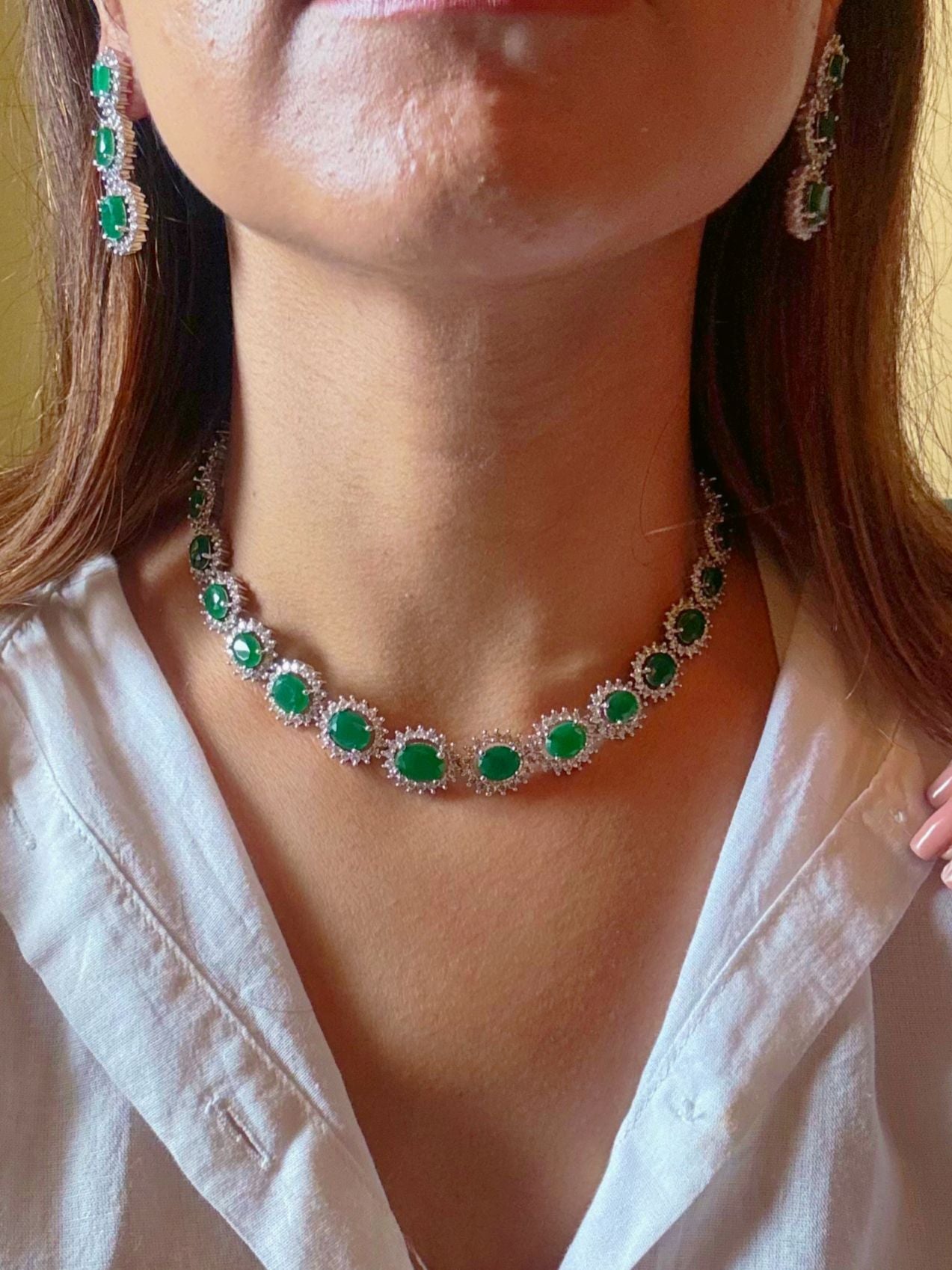 Shop Light Partywear AD Necklace in India. Explore elegant bridal AD jewellery online. Shop premium bridal jewellery sets in Zircon, AD, Kundan, Victorian Diamond. Collection best suited for Indian weddings, parties and special occasions. Choose AD Necklace In Green stone for weddings, sangeet and engagement. -front
