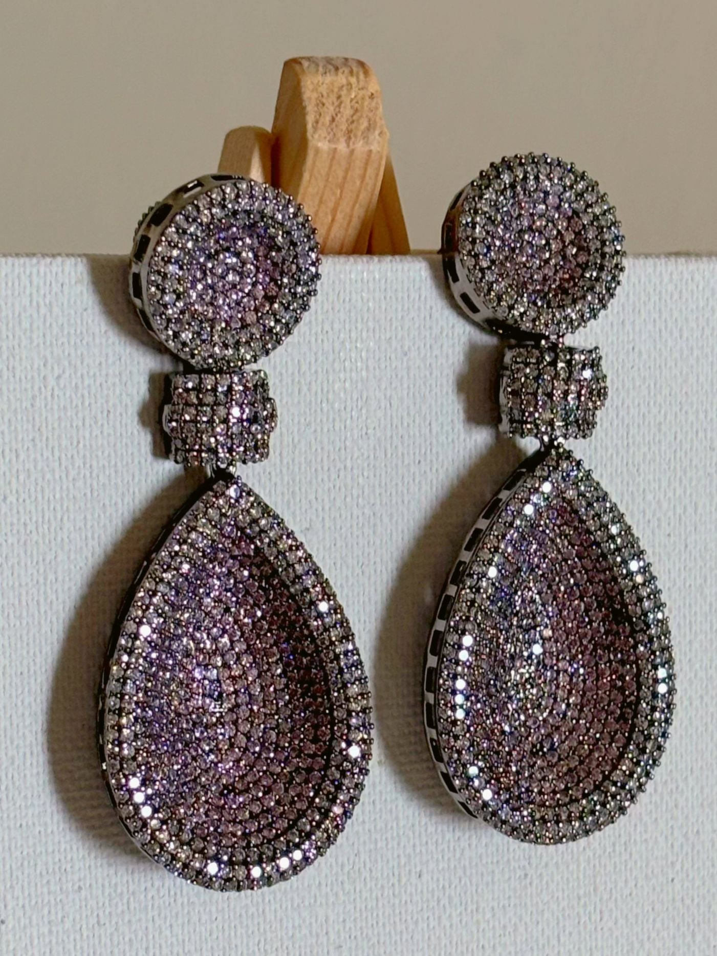 Shop women's Long Nano Setting AD Earrings In Pink online in India. Shop from an exclusive range of zircon jewellery, bridal wedding jewelry, silver plated earrings, rhodium plated jewellery, AD earrings, AD earrings sets for office parties, cocktail dresses and sangeet night. -front