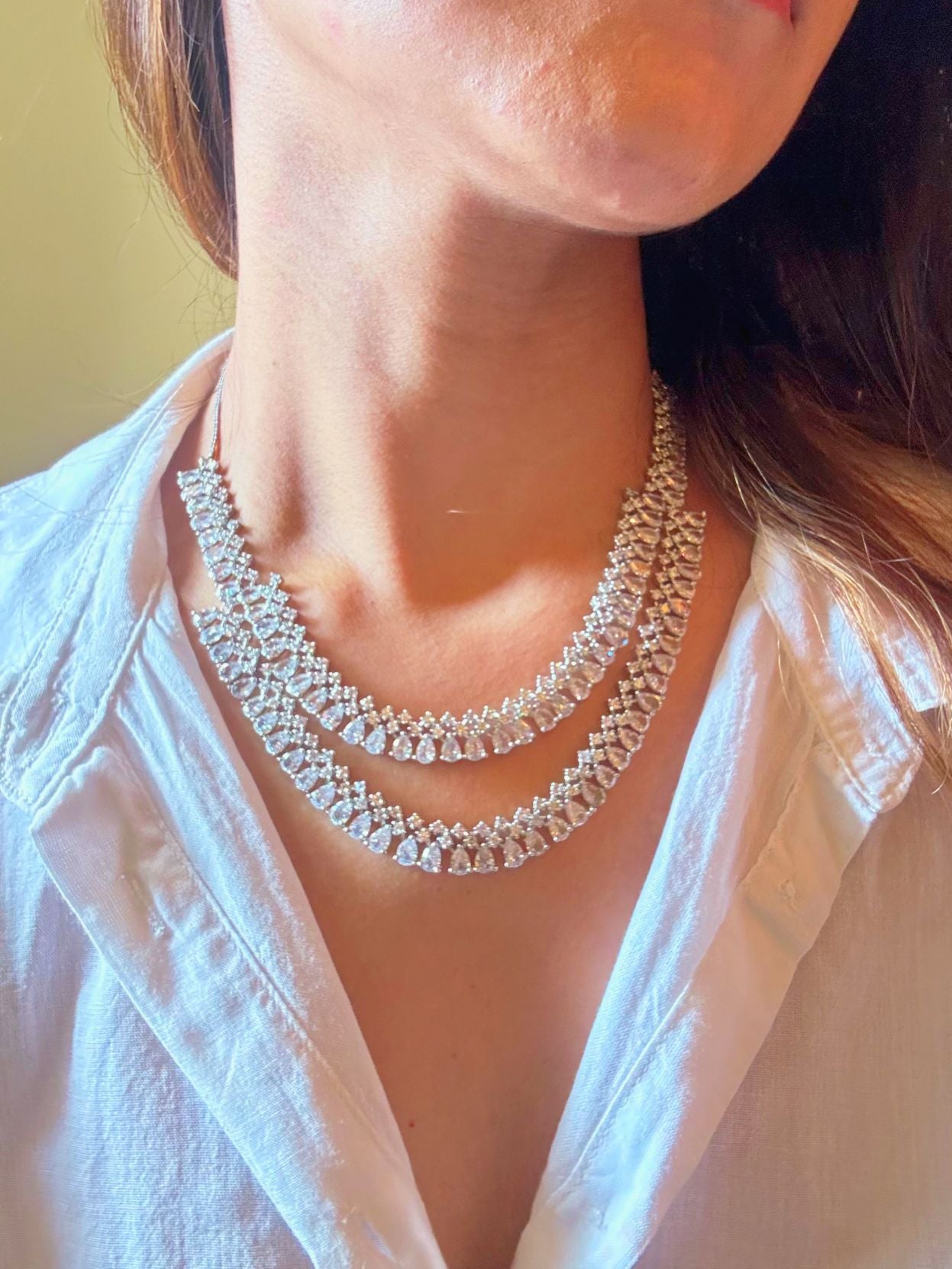 Shop Diamond Look bridal AD Necklace in India. Explore elegant bridal AD jewellery online. Shop premium bridal jewellery sets in Zircon, AD, Kundan, Victorian Diamond. Collection best suited for Indian weddings, parties and special occasions. Choose Diamond AD strings for sarees, lehengas and coats. -Upper