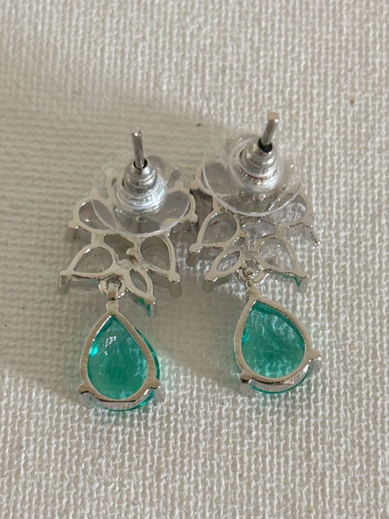 Shop Subtle Glow Green Stone Drop AD Earrings online in India. Shop from an exclusive range of zircon jewellery, bridal wedding jewelry, silver plated earrings, rhodium plated jewellery, AD earrings, AD necklace sets for Lehengas, suits, sarees and gowns. -back