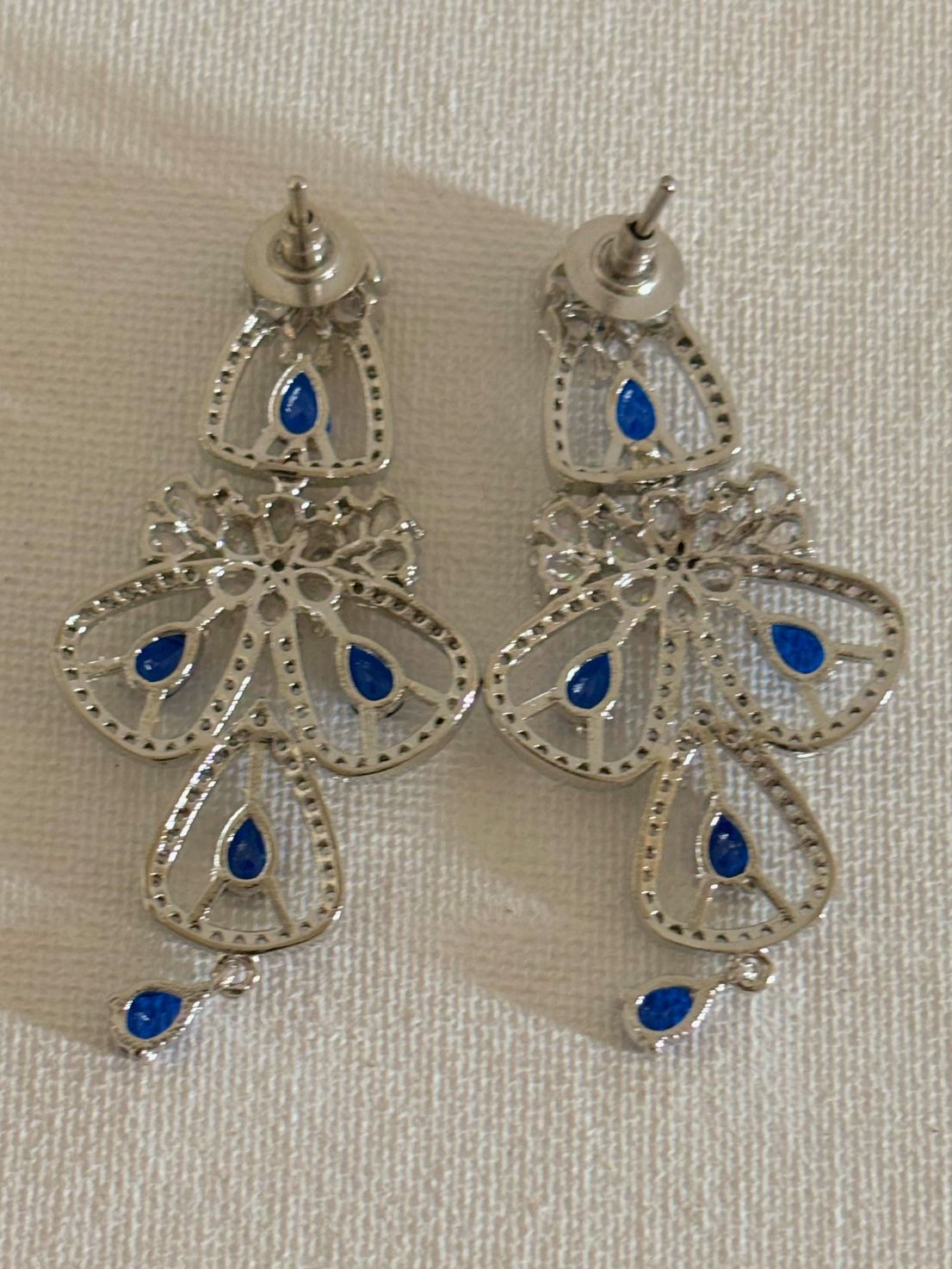 Shop women's luxury blue stone AD earrings online in India. Shop from an exclusive range of zircon jewellery, Indian wedding jewelry, gold plated earrings, rhodium plated jewellery, AD earrings, AD necklace sets for weddings, engagements and parties. -back