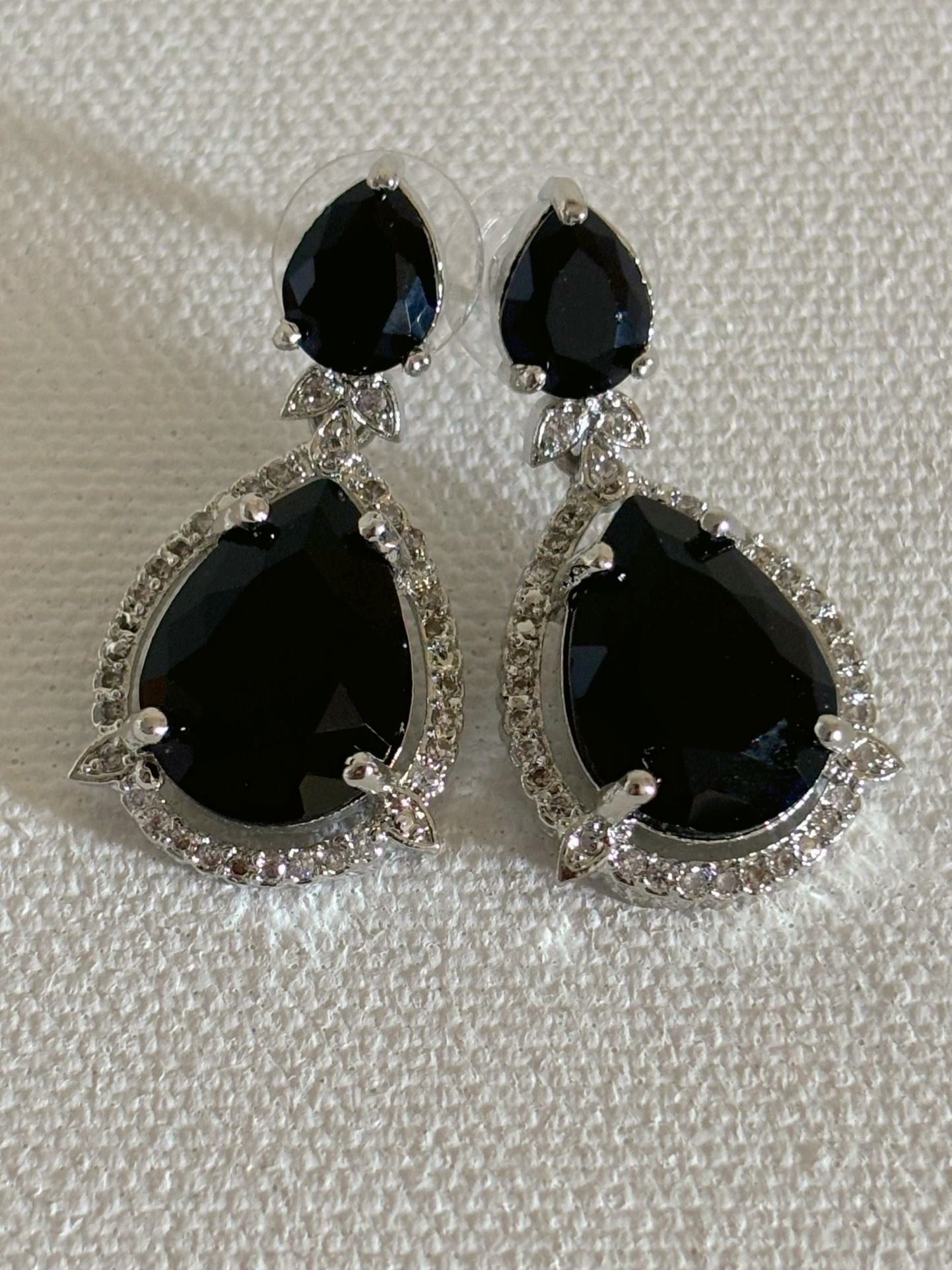 Shop Celebrity Look Double Drop Black Stone AD Earrings online. Shop from an exclusive range of zircon earrings, bridal AD jewelry, silver plated earrings, rhodium plated jewellery, AD earrings, AD necklace sets for coats, gowns and lehengas. -front