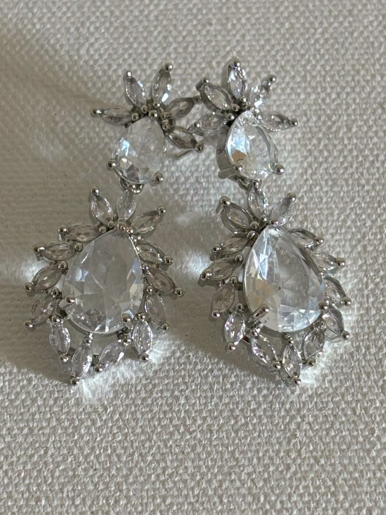 Shop Stylish Double Drop White Stone AD Earrings online. Shop from an exclusive range of zircon earrings, bridal AD jewelry, silver plated earrings, rhodium plated jewellery, AD earrings, AD necklace sets for coats, gowns and lehengas. -front