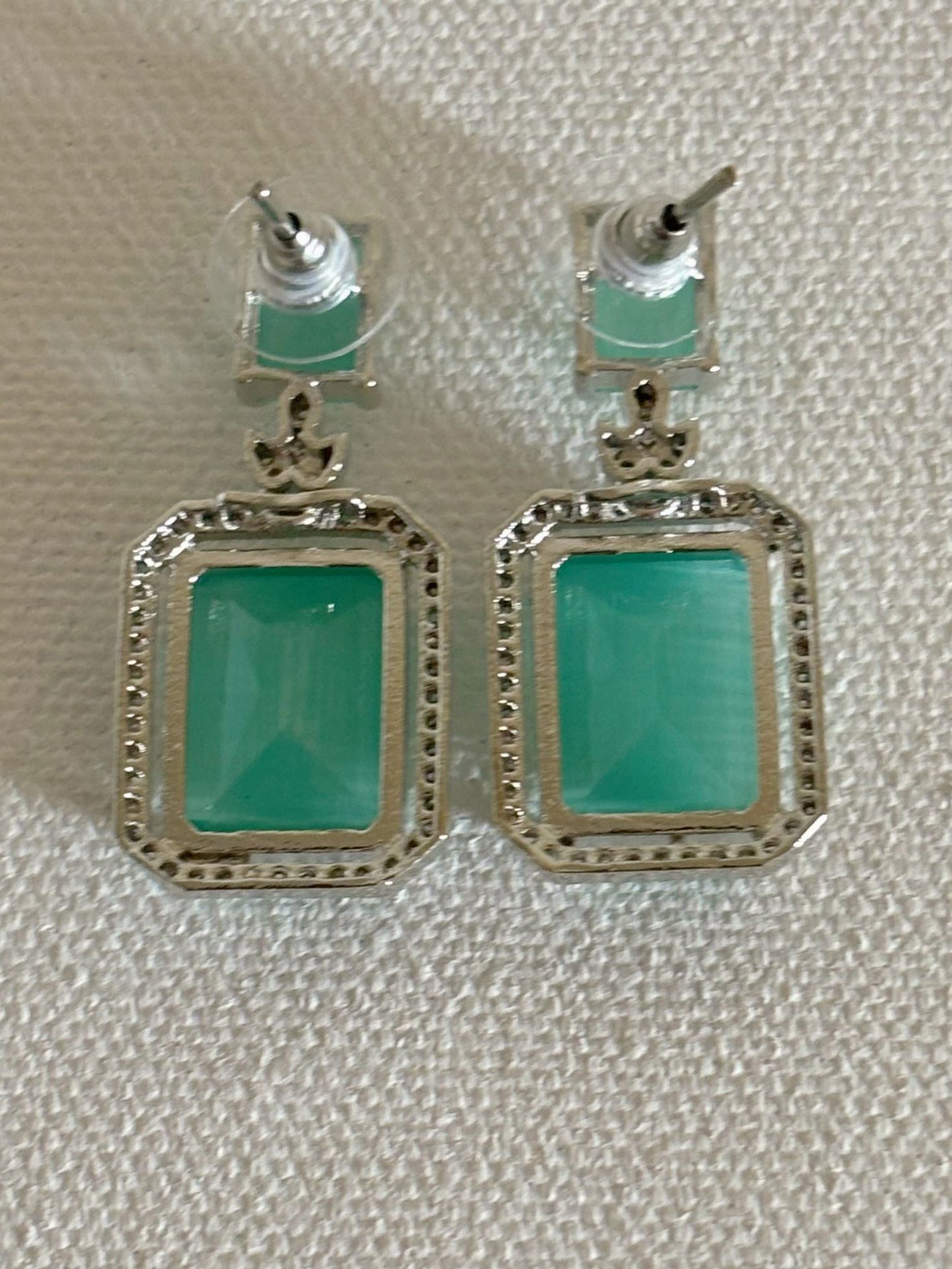 Shop women's luxury white doublet stone AD earrings online in India. Shop from an exclusive range of zircon jewellery, Indian wedding jewelry, AD earrings with saree, rhodium plated jewellery, AD necklace sets for weddings and engagement. AD jewellery in mint green stone. -back