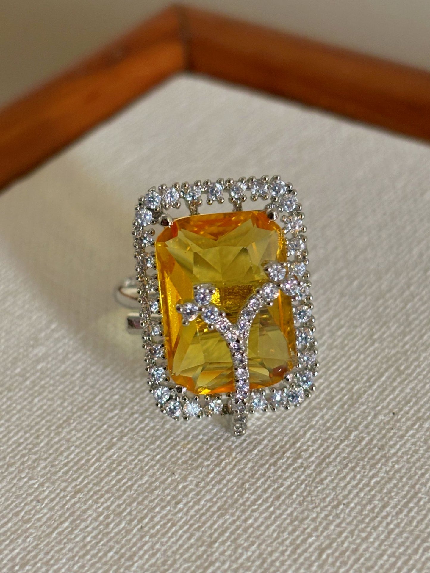 Shop Golden Yellow Doublet Stone AD Ring online in India. Shop from an exclusive range of zircon jewellery, bridal wedding jewellery, silver plated earrings, rhodium plated rings, AD rings, AD earrings for office parties, cocktail dresses and sangeet night. -front