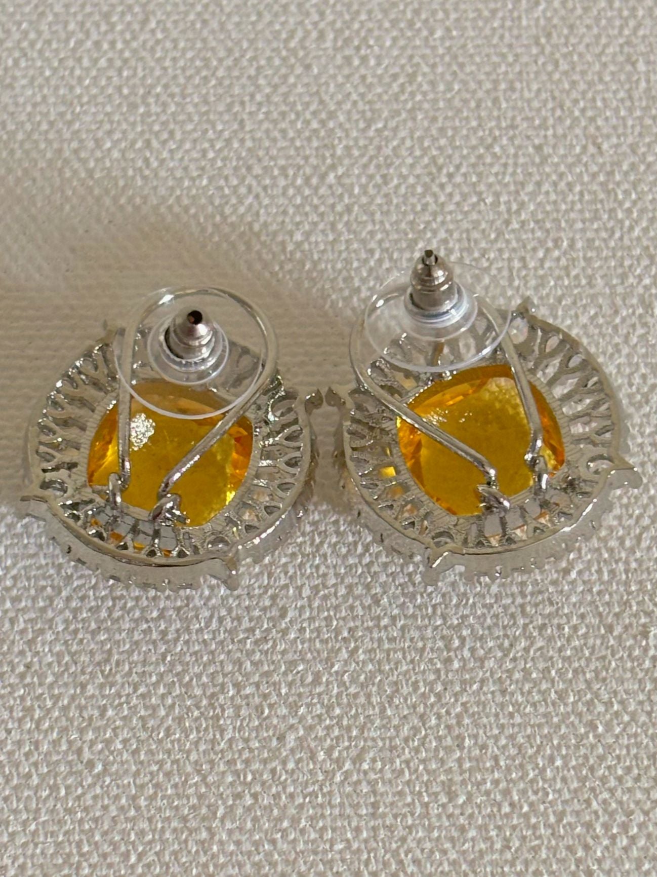 Shop Contemporary Studs In AD & Golden Yellow Stone online. Shop from an exclusive range of zircon earrings, bridal AD jewelry, silver plated earrings, rhodium plated jewellery, AD earrings, AD necklace sets for weddings, engagements and parties. -back