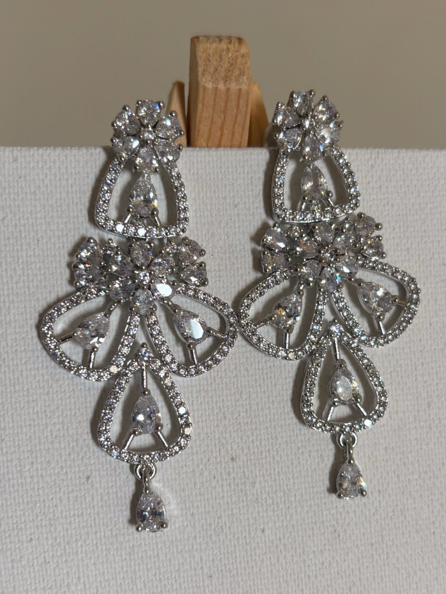 Shop women's Flower Shaped Long AD Earrings In White online in India. Shop from an exclusive range of zircon jewellery, Indian wedding jewelry, gold plated earrings, rhodium plated jewellery, AD earrings, AD necklace sets for weddings, engagements and parties. -first