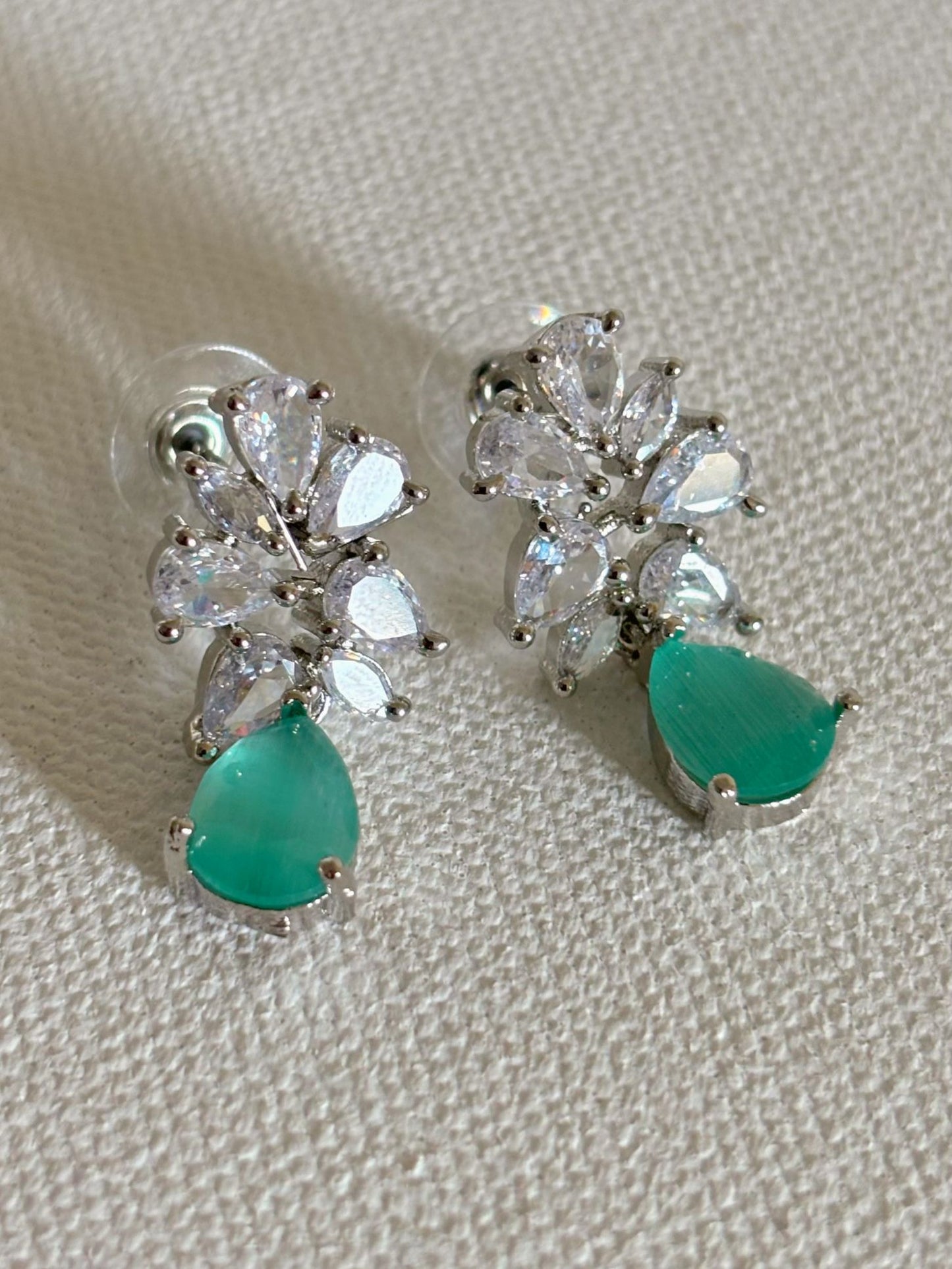 Shop Subtle Glow Mint Green Stone Drop AD Earrings online in India. Shop from an exclusive range of zircon jewellery, bridal wedding jewelry, silver plated earrings, rhodium plated jewellery, AD earrings, AD necklace sets for Lehengas, suits, sarees and gowns. -first