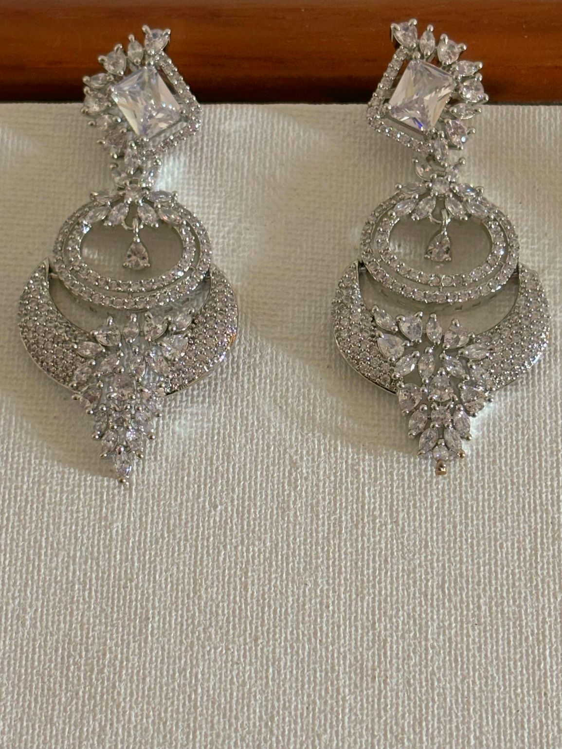 Shop women's Designer AD Earrings With White Stones online in India. Shop from an exclusive range of zircon jewellery, bridal wedding jewelry, silver plated earrings, rhodium plated jewellery, AD earrings, AD necklace sets for Lehengas, suits, sarees and gowns. -front