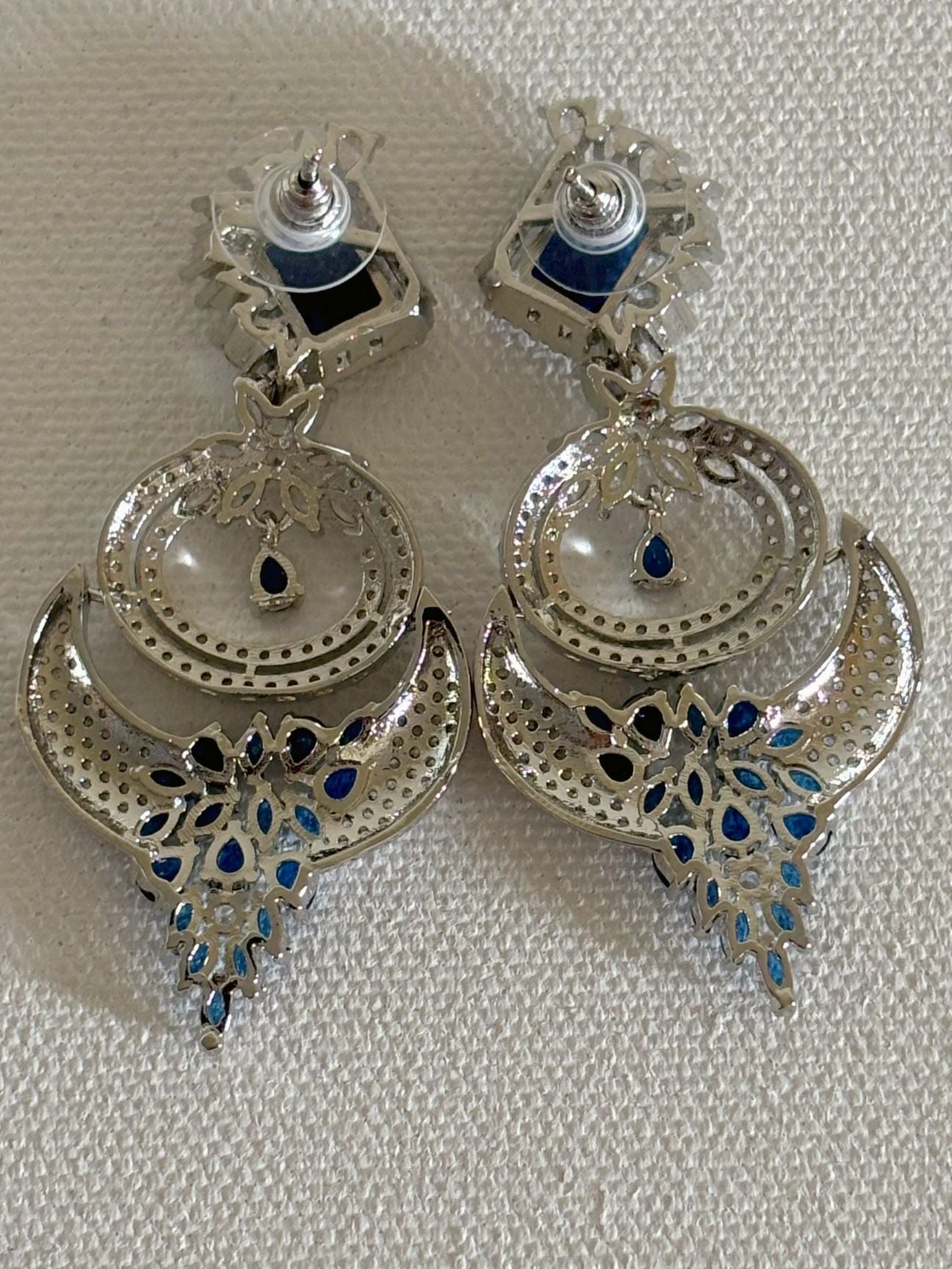 Shop women's Designer AD Earrings With Blue Stone online in India. Shop from an exclusive range of zircon jewellery, bridal wedding jewelry, silver plated earrings, rhodium plated jewellery, AD earrings, AD necklace sets for Lehengas, suits, sarees and gowns. -back