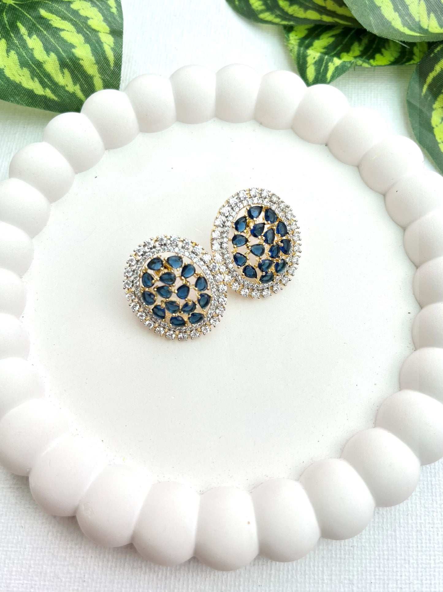 Shop Oval Studs In Blue & AD Stones online in India. Shop from an exclusive range of zircon jewellery, bridal wedding jewelry, silver plated earrings, rhodium plated jewellery, AD earrings, AD earrings sets for office parties, party wear and weddings. -front