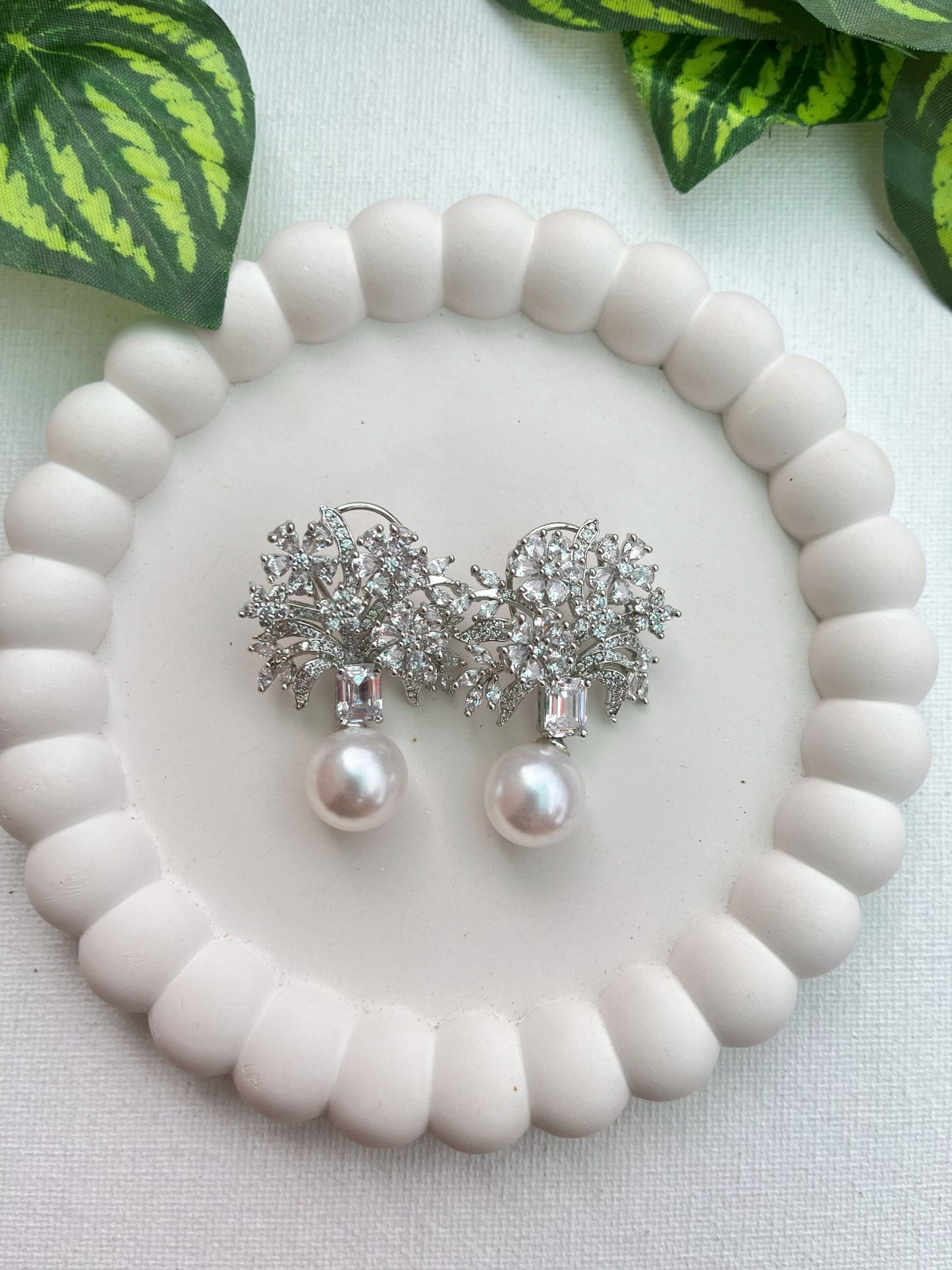 Shop Etasha CZ Floral Earrings With Big Pearl Drop online in India. Shop AD earrings, bridal AD jewelry, AD necklace sets for weddings, engagements and parties.
