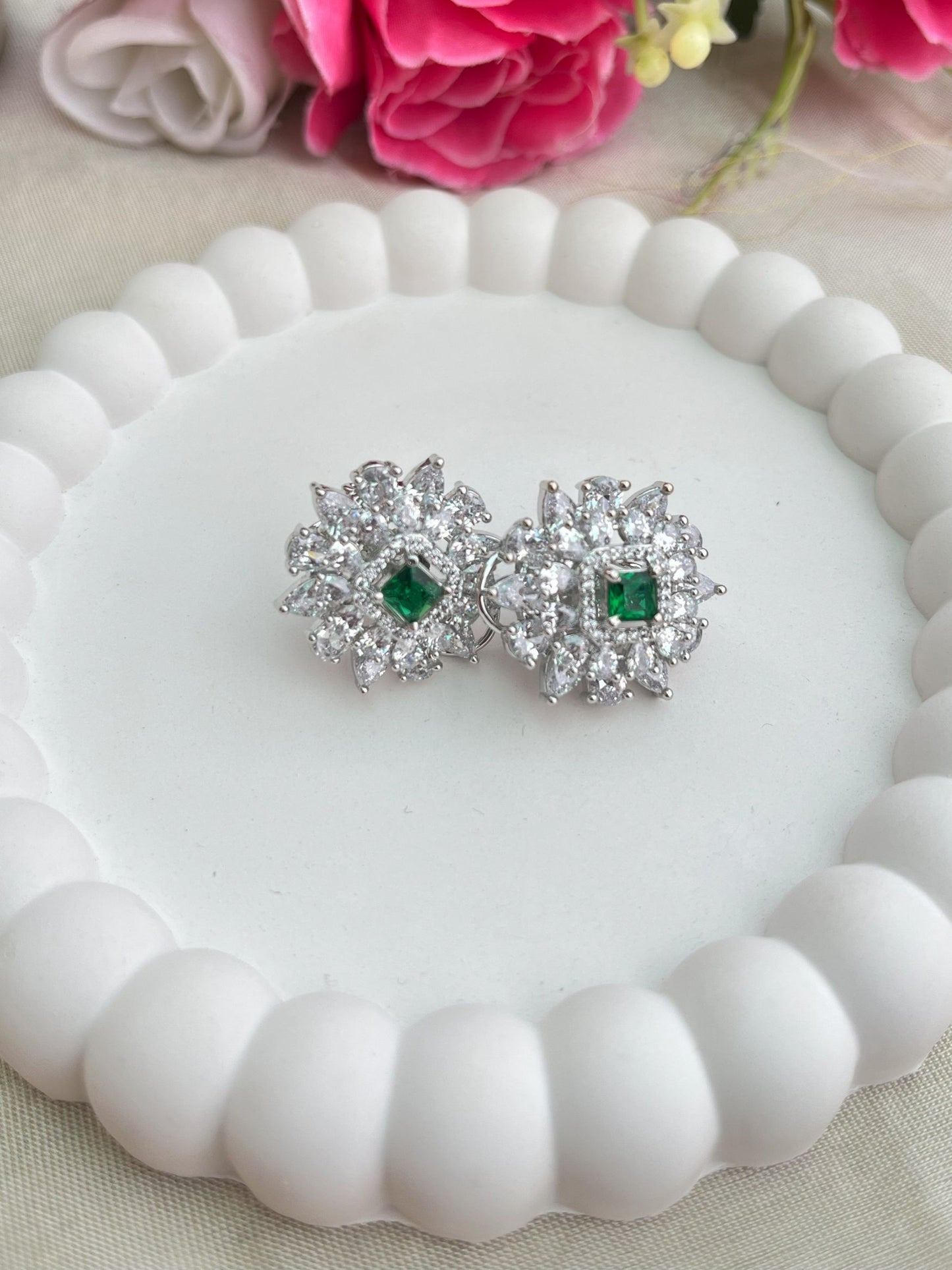 Shop CZ Stones Stud Earrings In Green Stone online in India. Shop AD earrings, bridal AD jewelry, AD necklace sets for weddings, engagements and parties.