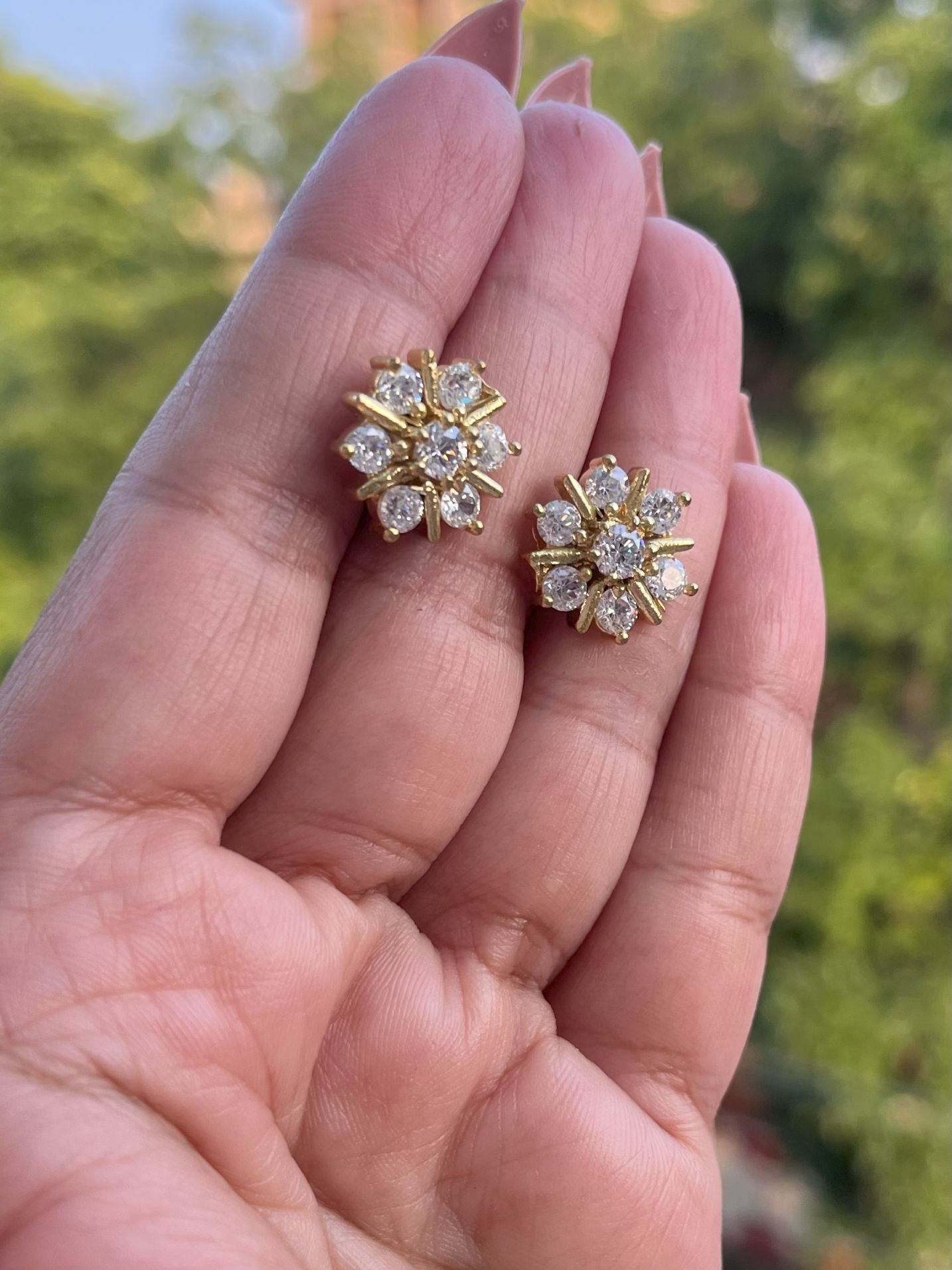 Shop  Flower Shaped AD Studs Earrings online in India. Shop from an exclusive range of zircon jewellery, Indian wedding jewelry, gold plated earrings, rhodium plated jewellery, AD earrings, AD necklace sets for weddings, engagements and parties. -front