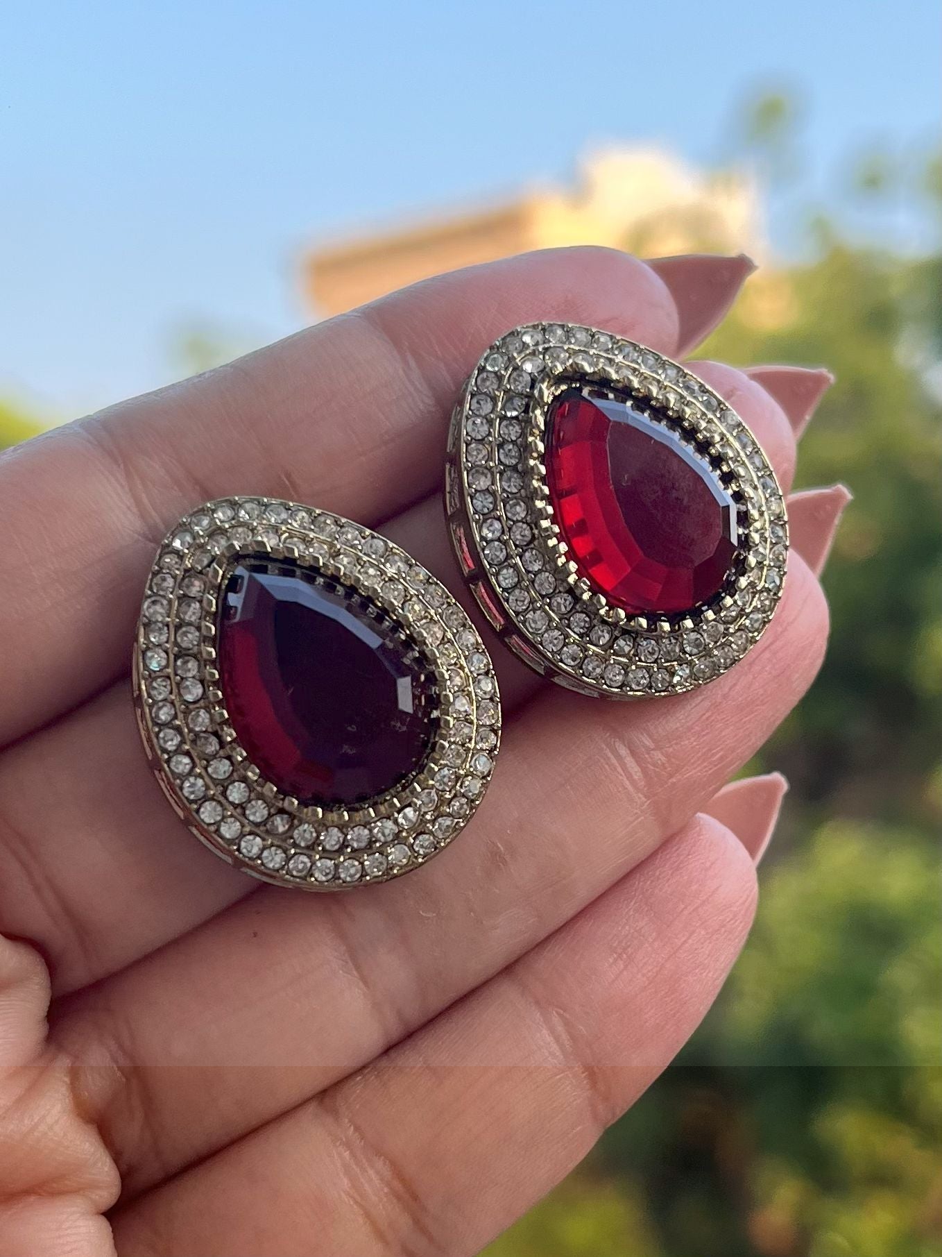 Shop Oval Glass Stone Stud Earrings In Red online in India. Shop from an exclusive range of CZ jewellery, gold plated, silver, mehendi polish earrings.