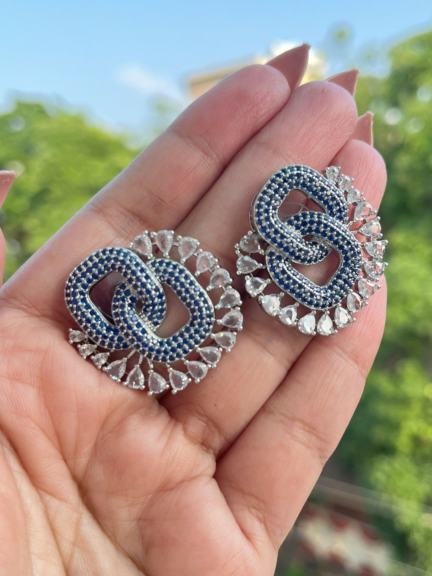 Shop Premium CZ Stones Stud Earrings In Blue online in India. Shop AD earrings, bridal AD jewelry, AD necklace sets for weddings, engagements and parties.