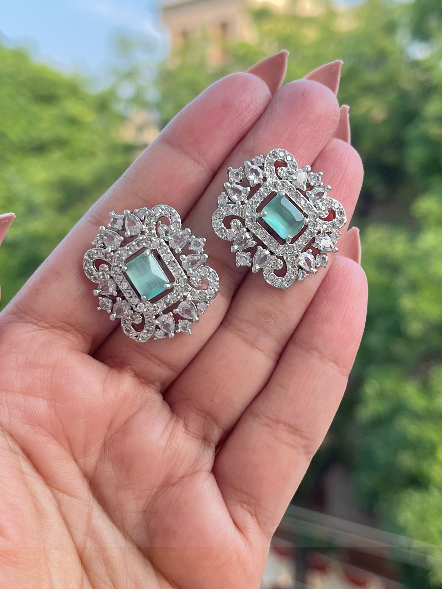Shop Premium CZ Stones Stud Earrings In Green online in India. Shop AD earrings, bridal AD jewelry, AD necklace sets for weddings, engagements and parties.