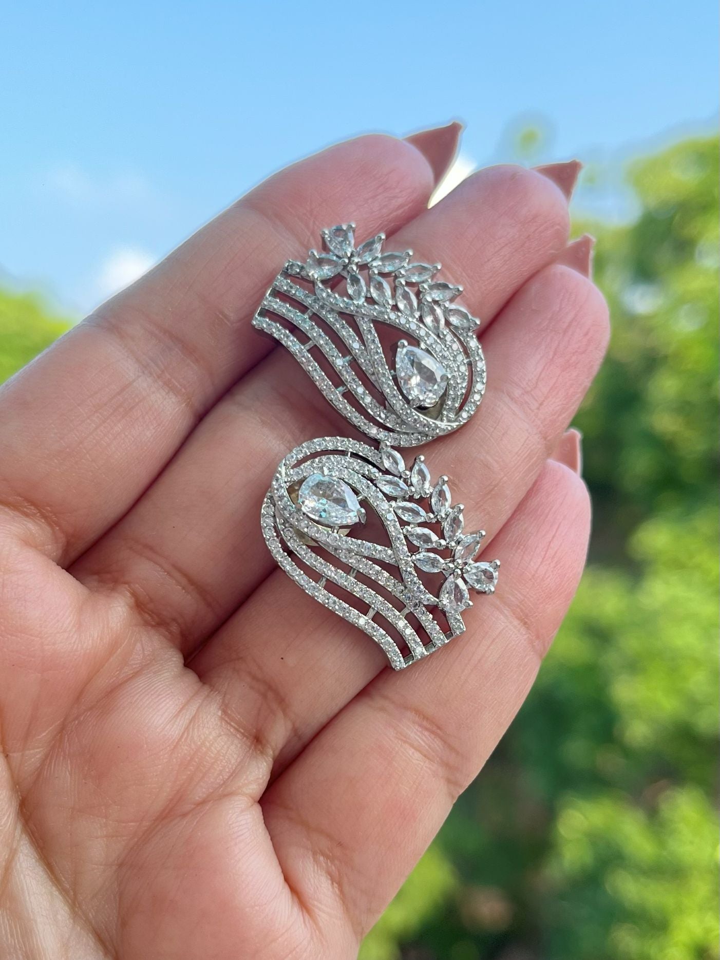 Shop Zuri Premium CZ Stones Stud Earrings In White online in India. Shop AD earrings, bridal AD jewelry, AD necklace sets for weddings, engagements and parties.