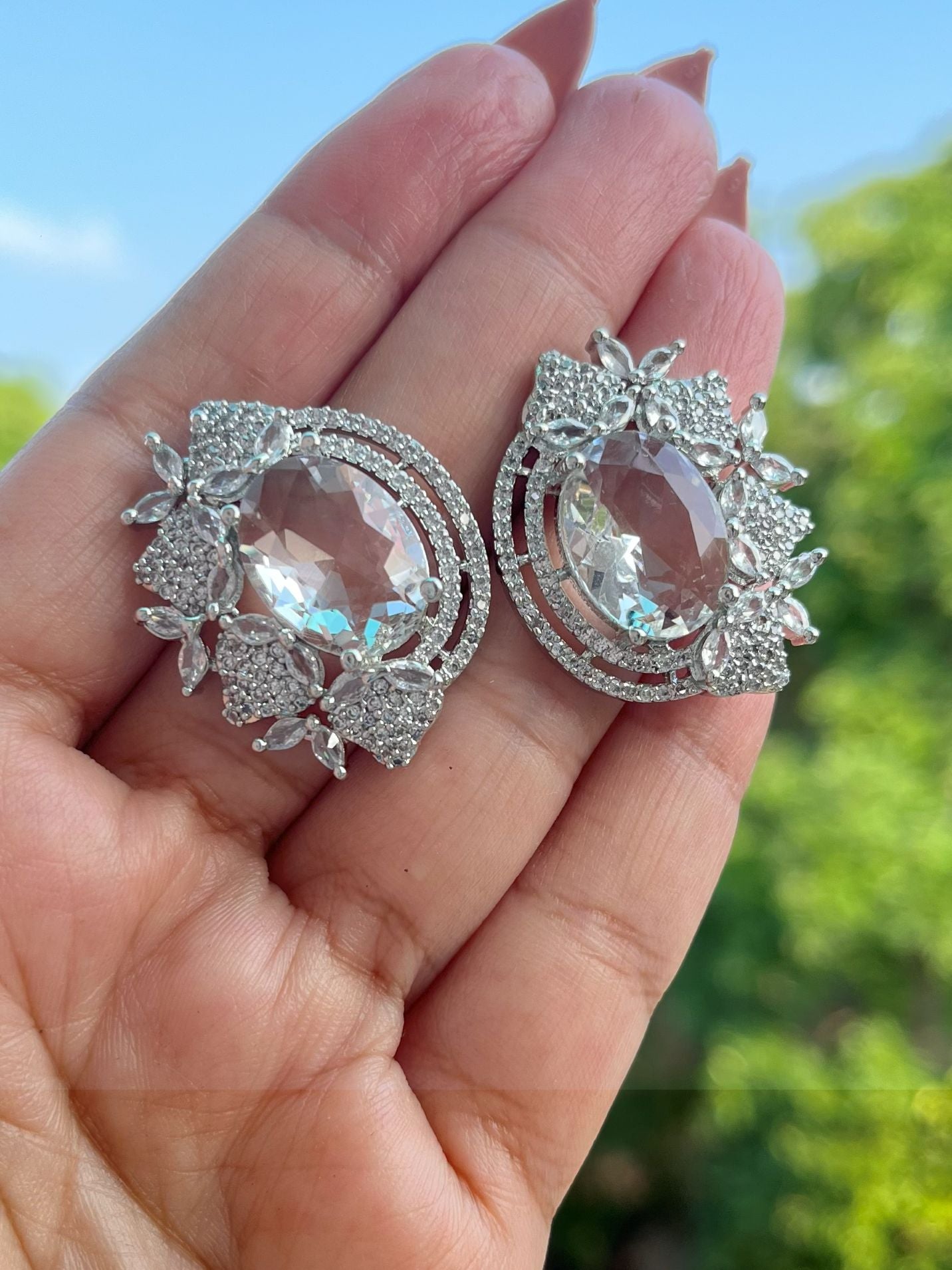 Shop Hania Premium CZ Stones Big Stud Earrings In White online in India. Shop AD earrings, bridal AD jewelry, AD necklace sets for weddings, engagements and parties.