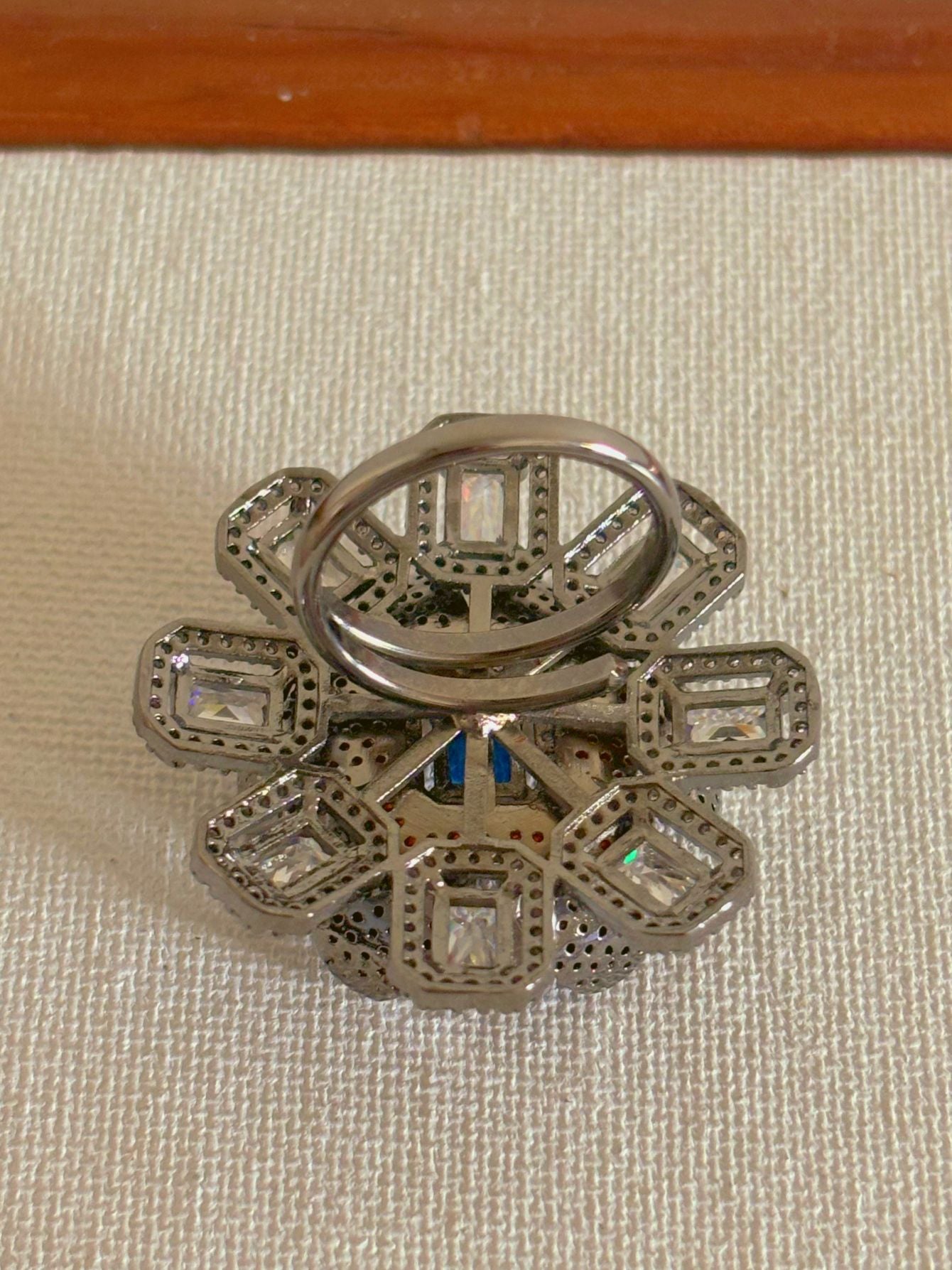 Shop Adjustable Nano Setting Floral Shape AD Cocktail Ring online in India. Shop from an exclusive range of zircon jewellery, bridal wedding jewellery, silver plated earrings, rhodium plated rings, AD rings, AD earrings for office parties, cocktail dresses and sangeet night. -back