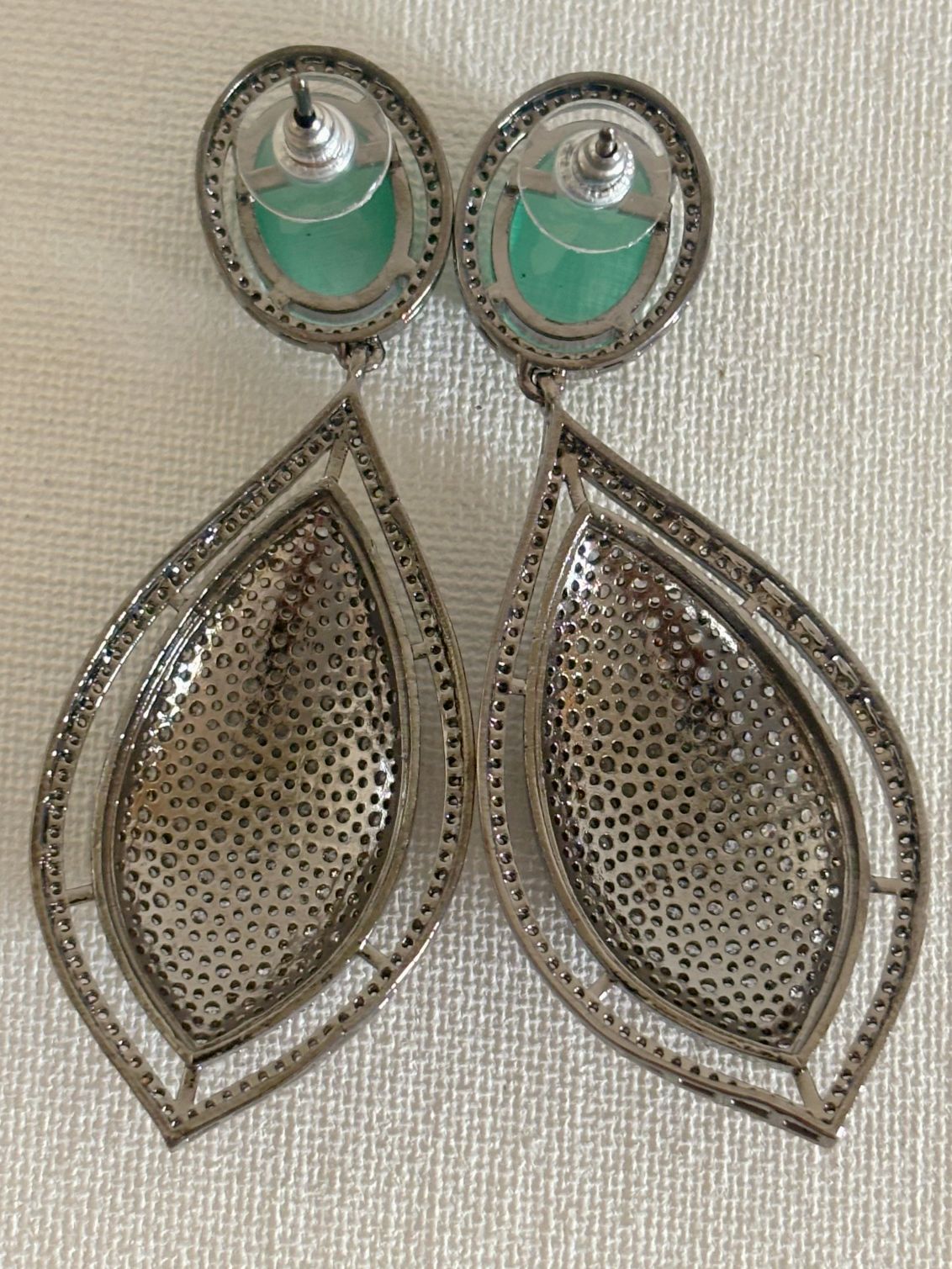 Shop women's Designer Nano Setting AD Earrings With Mint Green Stone online in India. Shop from an exclusive range of zircon jewellery, bridal wedding jewelry, silver plated earrings, rhodium plated jewellery, AD earrings, AD necklace sets for Lehengas, suits, sarees and gowns. -back