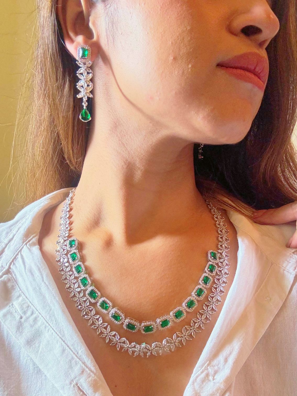Shop Diamond Look bridal AD Necklace in India. Explore elegant bridal AD jewellery online. Shop premium bridal jewellery sets in Zircon, AD, Kundan, Victorian Diamond. Collection best suited for Indian weddings, parties and special occasions. Choose AD Necklace In Green stone for sarees, lehengas and coats. -Side