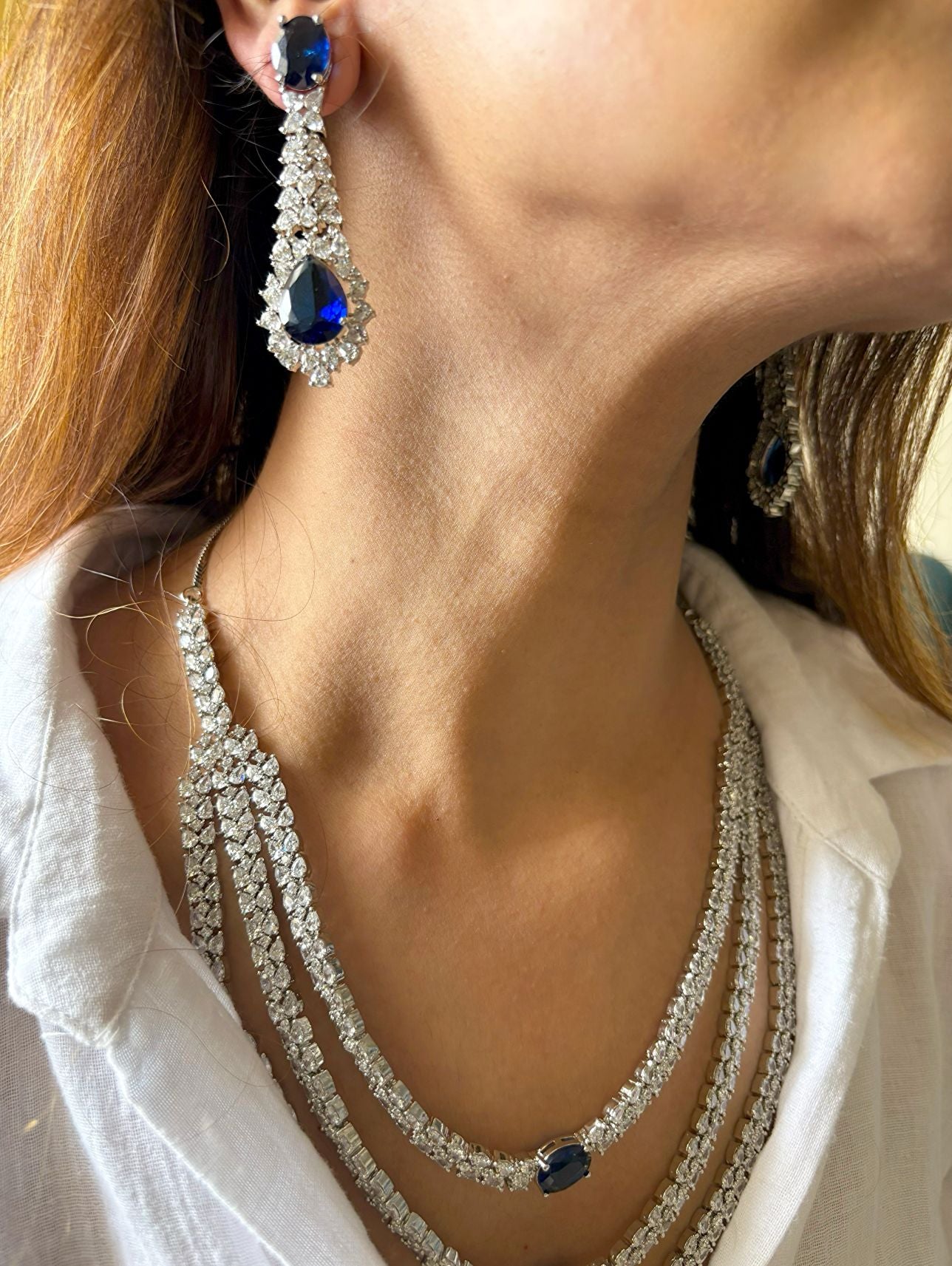 Shop Premium Three Layer AD Set In Sapphire Stone online in India. Explore elegant bridal AD jewellery online. Shop premium bridal jewellery sets in Zircon, AD, Kundan, Victorian Diamond. Collection best suited for Indian weddings, parties and special occasions. Choose AD Necklace in blue stone for sarees, lehengas and gowns. -side