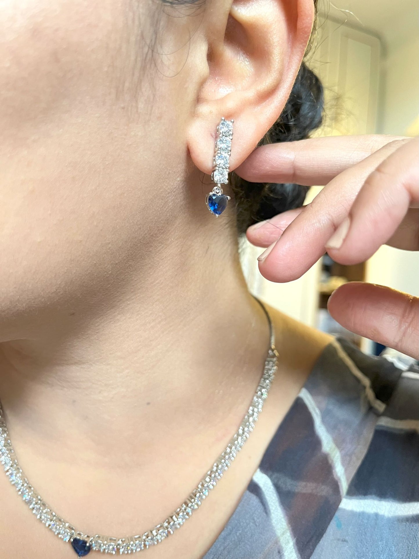 Shop Solitaire Look String With Blue Heart Shaped Stone In CZ online in India. Explore elegant bridal AD jewellery online. Shop premium bridal jewellery sets in Zircon, AD, Kundan, Victorian Diamond. Collection best suited for Indian weddings, parties and special occasions. Buy solitaire string in blue stone for sarees, lehengas and gowns. -withearrings