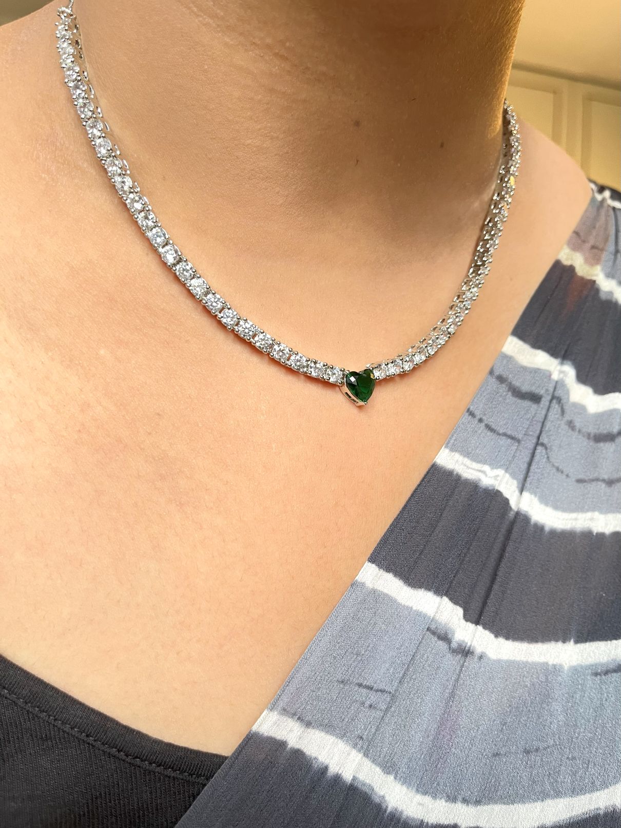 Shop Solitaire Look String With Green Heart Shaped Stone In CZ online in India. Explore elegant bridal AD jewellery online. Shop premium bridal jewellery sets in Zircon, AD, Kundan, Victorian Diamond. Collection best suited for Indian weddings, parties and special occasions. Buy solitaire string in green stone for sarees, lehengas and gowns. -side