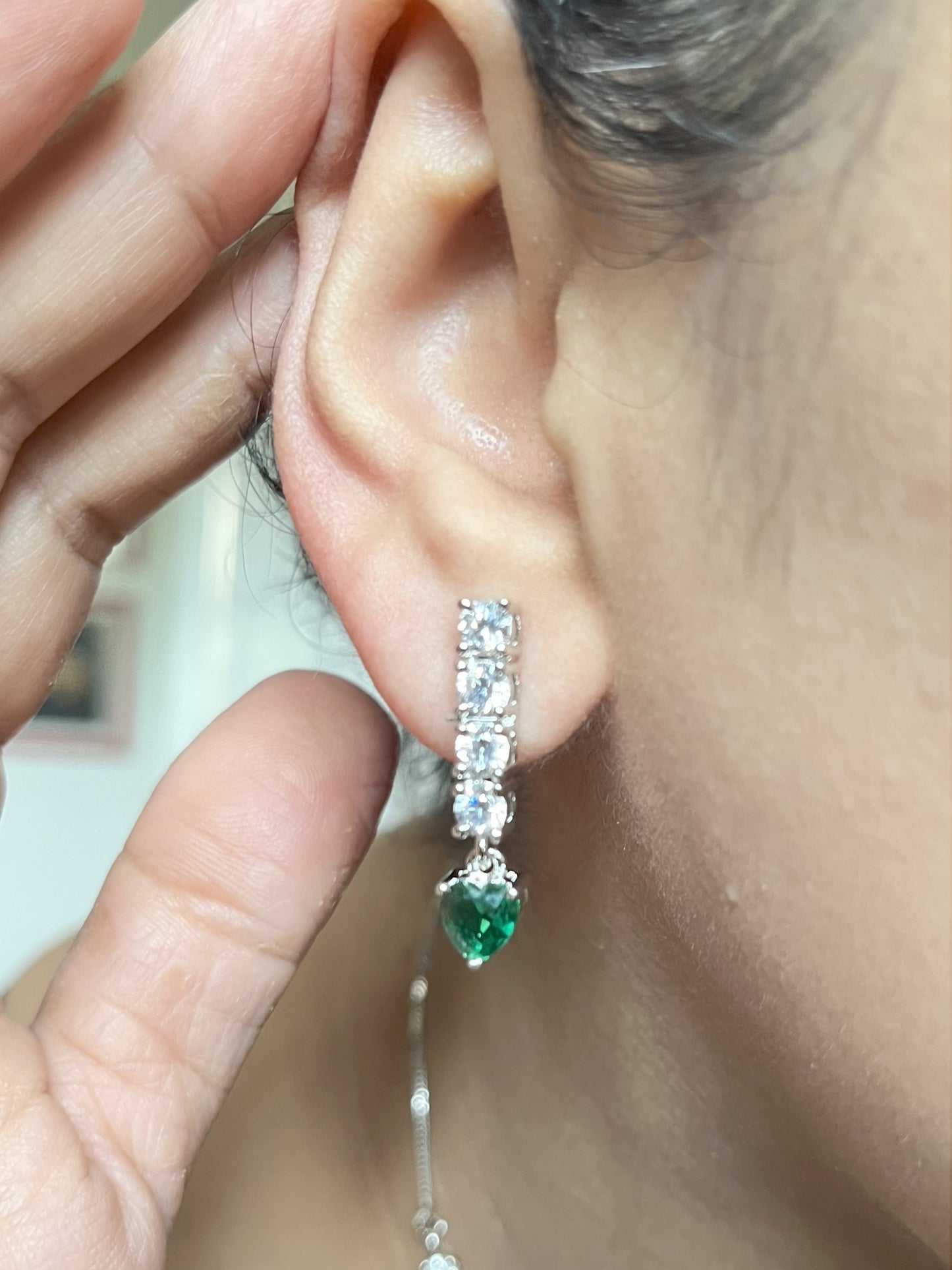Shop Solitaire Look String With Green Heart Shaped Stone In CZ online in India. Explore elegant bridal AD jewellery online. Shop premium bridal jewellery sets in Zircon, AD, Kundan, Victorian Diamond. Collection best suited for Indian weddings, parties and special occasions. Buy solitaire string in green stone for sarees, lehengas and gowns. -withearrings